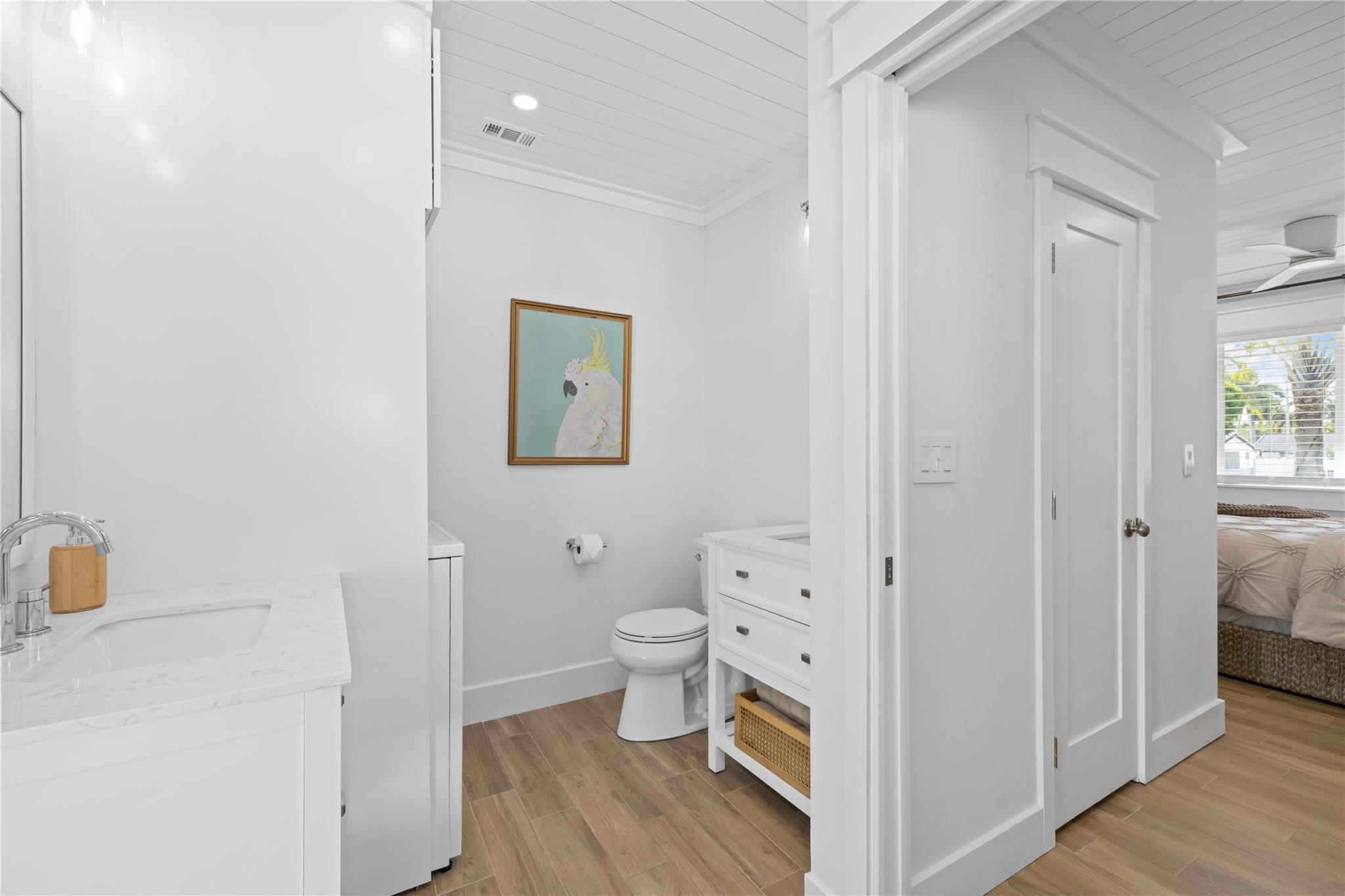 Primary ensuite bath features separate, custom vanities!