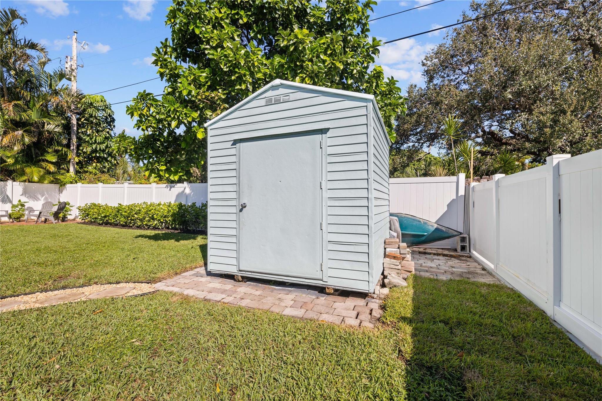 Matching garden shed with plenty of room for the lawn mower or yard decorations!