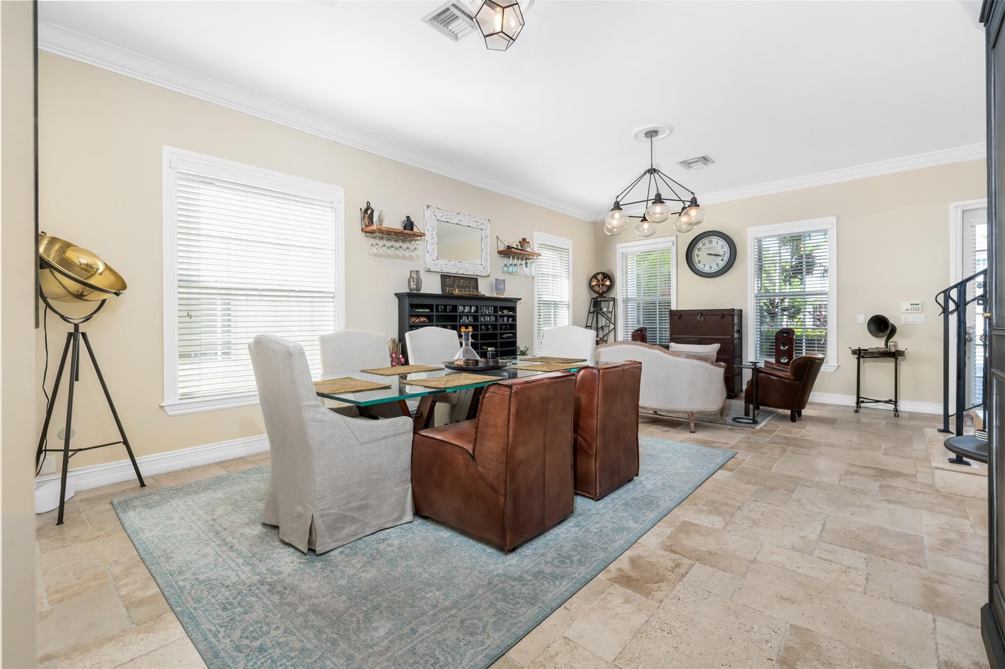 LIVING/DIN ROOM LOOKING TOWARDS FRONT DOOR