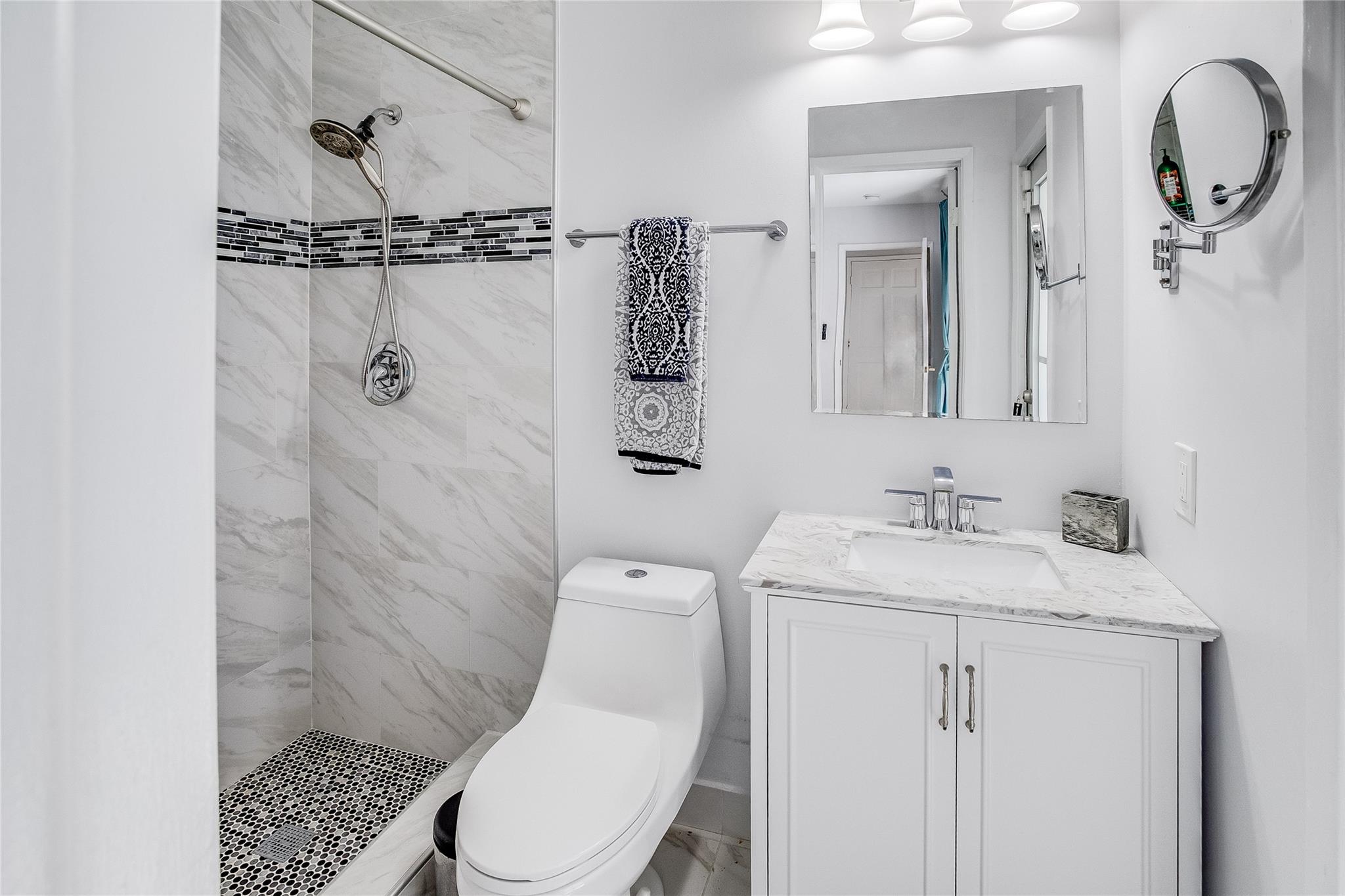 Bathroom with tub and shower.