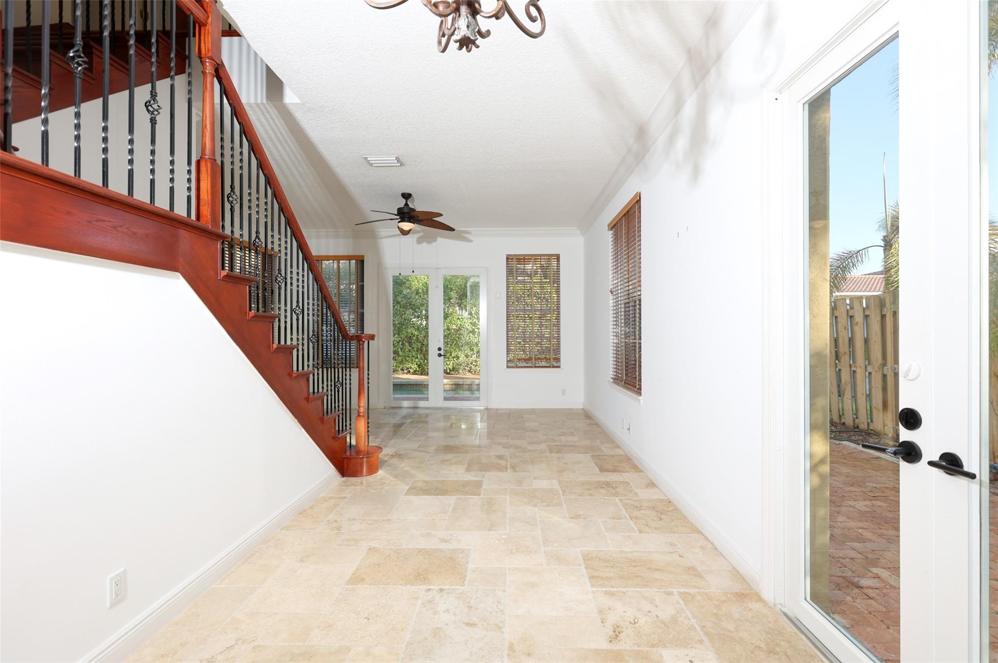Dining Room Leading Into Poolside Living/Sitting Room