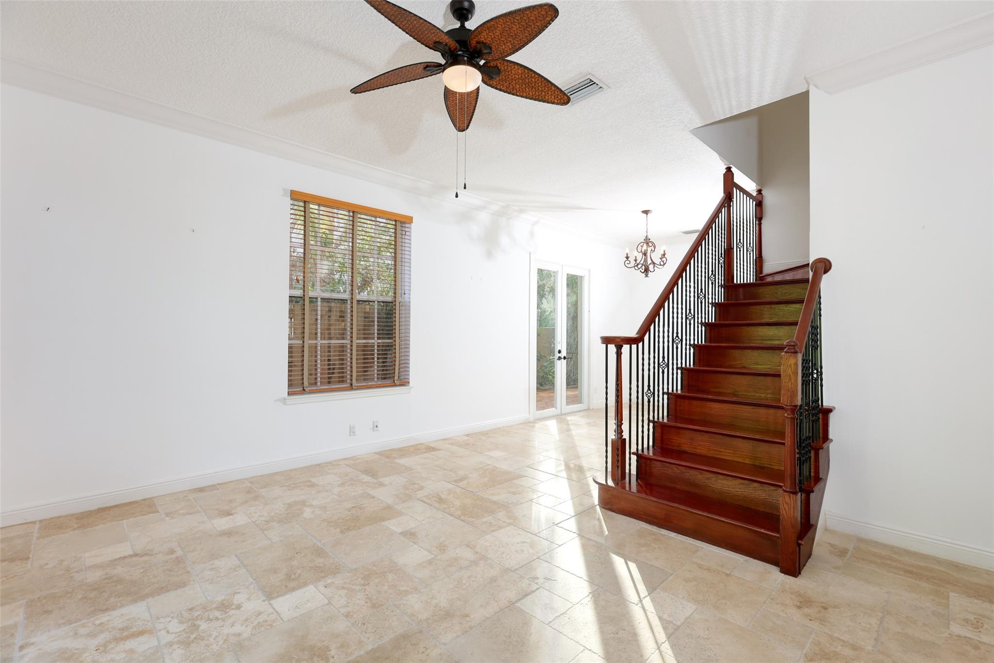 Living/Sitting Room With Wood Stairs Leading to Bedrooms
