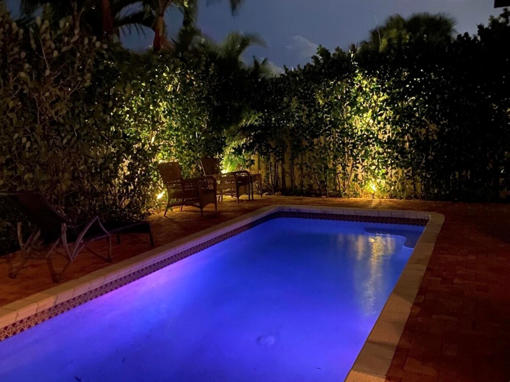 Nighttime Pool And Landscape Lights Provide A Private Tropical Paradise
