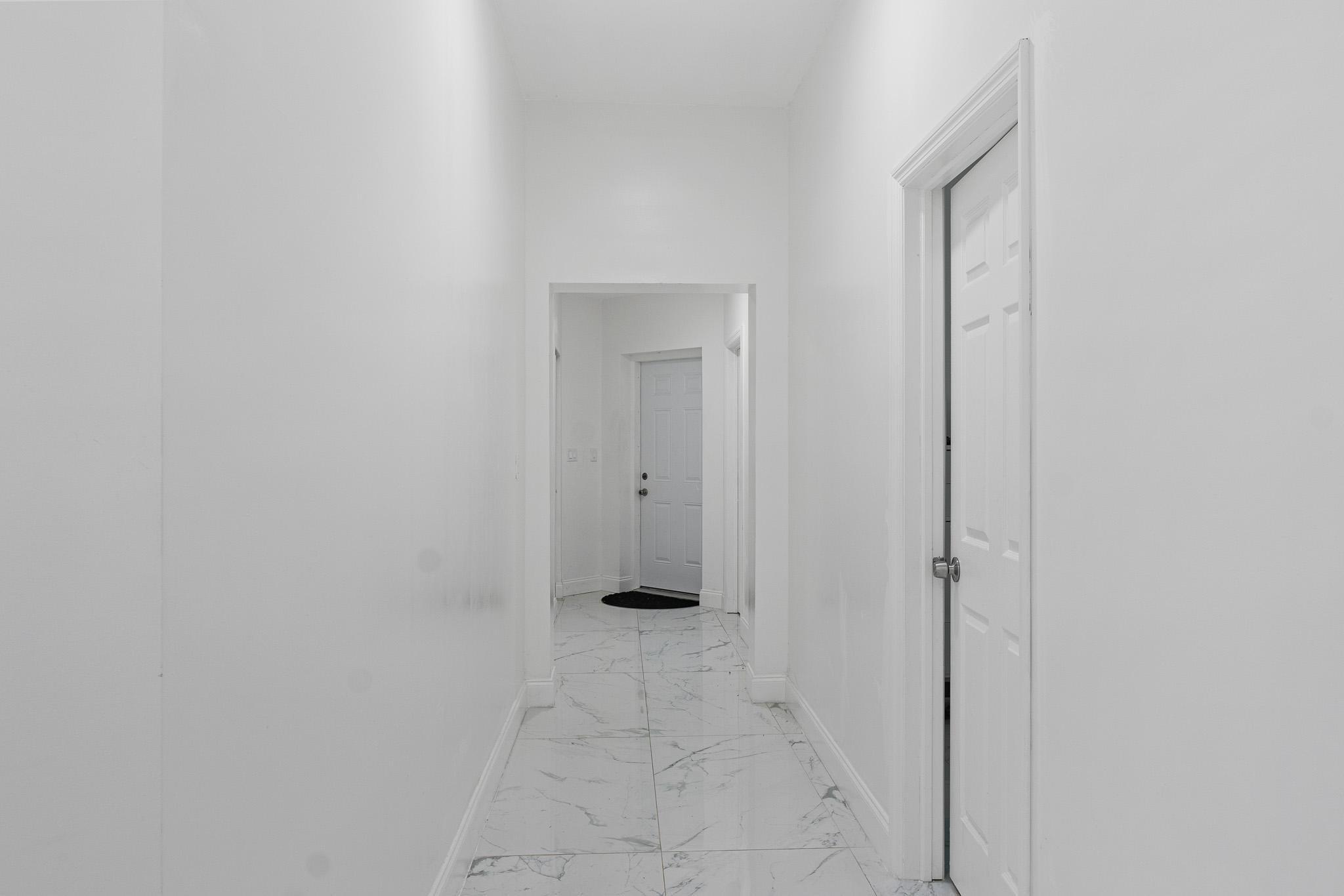 Hallway to Garage and Laundry Room