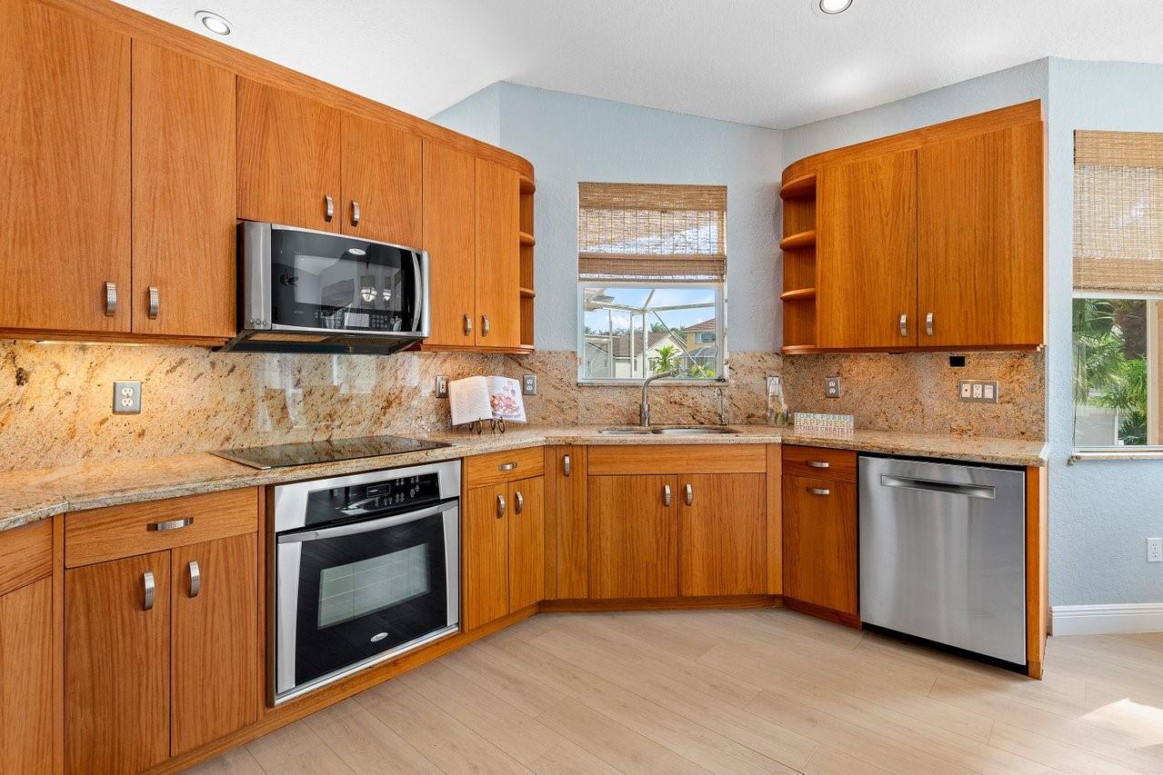 Beautifully appointed kitchen with pass through window to patio!