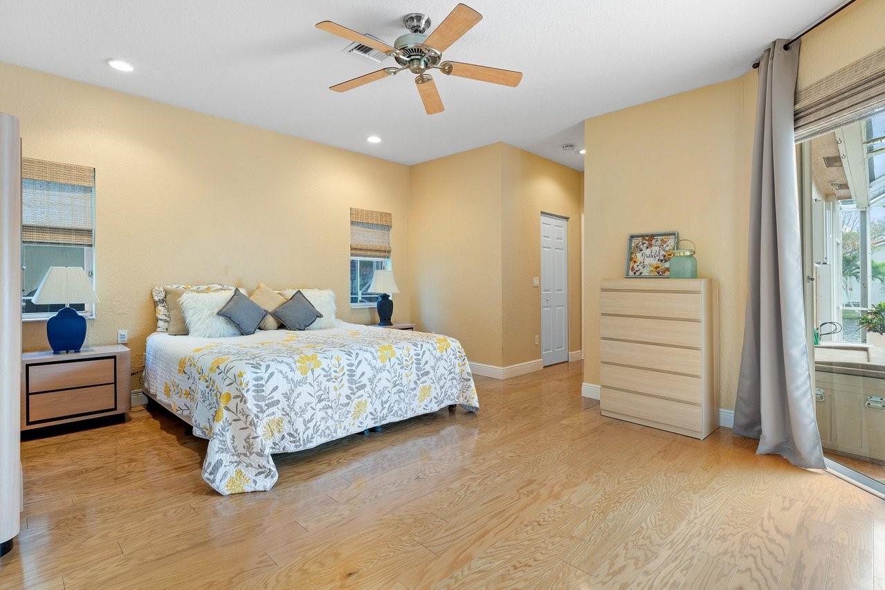 Primary suite is light bright and enables beautiful patio and water views!