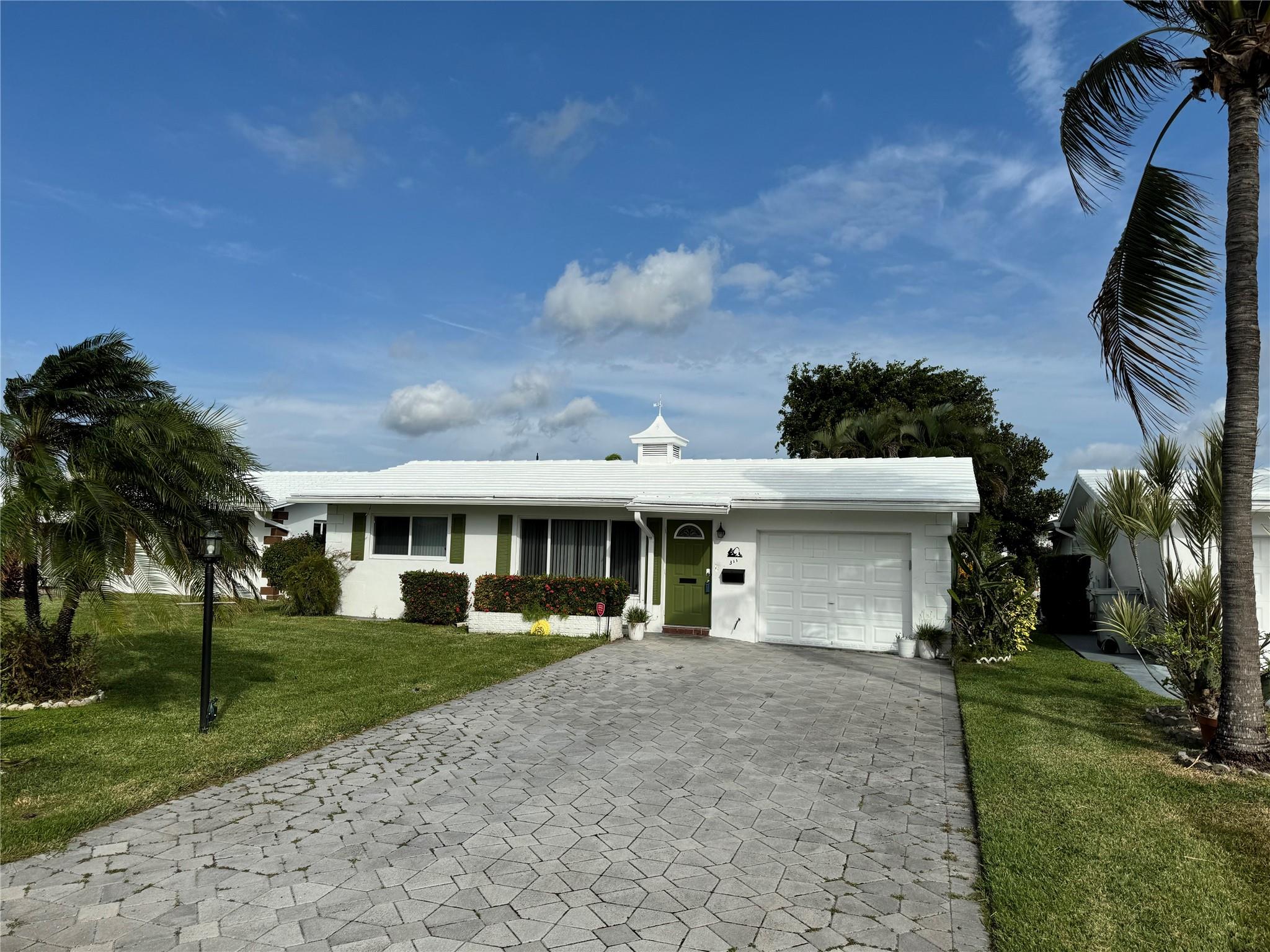 Extra wide driveway easily accommodates 4 big cars