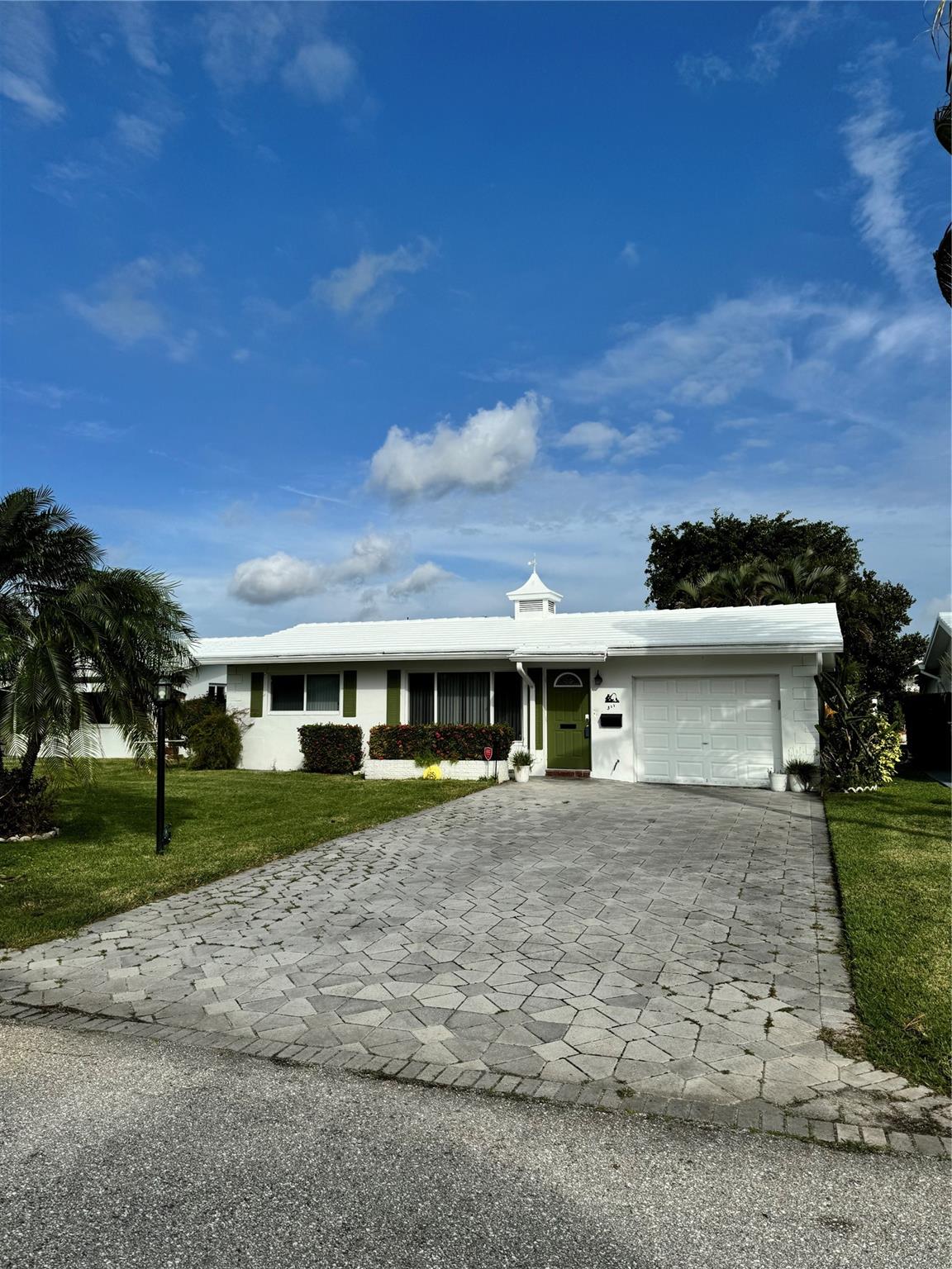 Extra wide driveway easily accommodates four big cars.