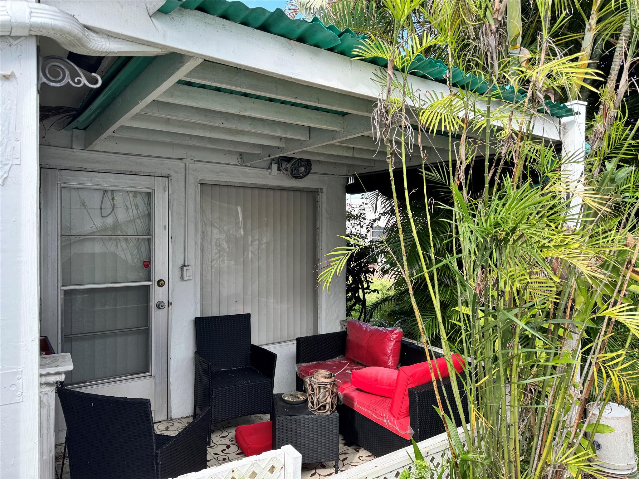 Your secret patio  hideaway tucked out back, surrounded by privacy foliage