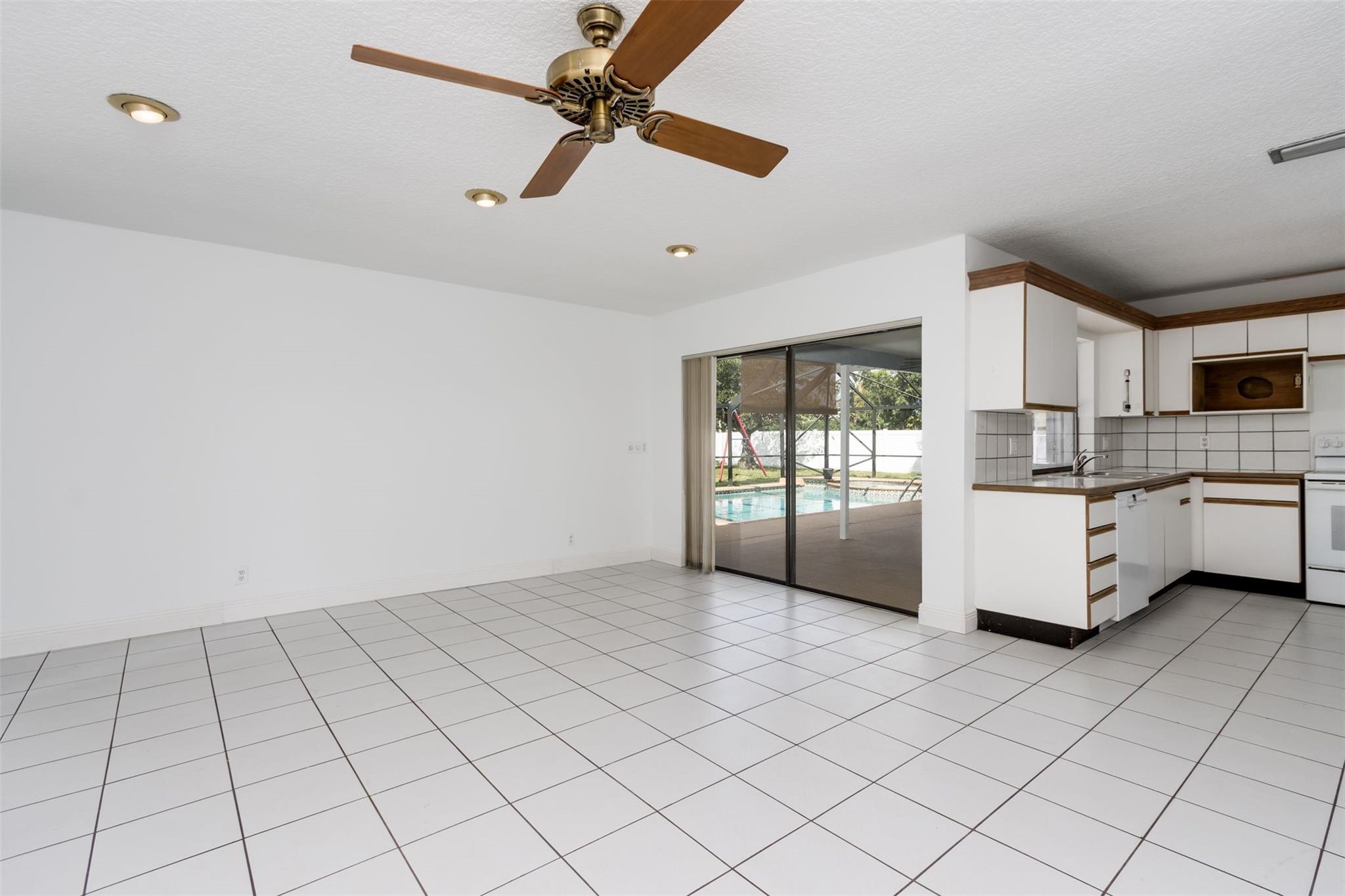 Family room looking toward kitchen and pool/patio