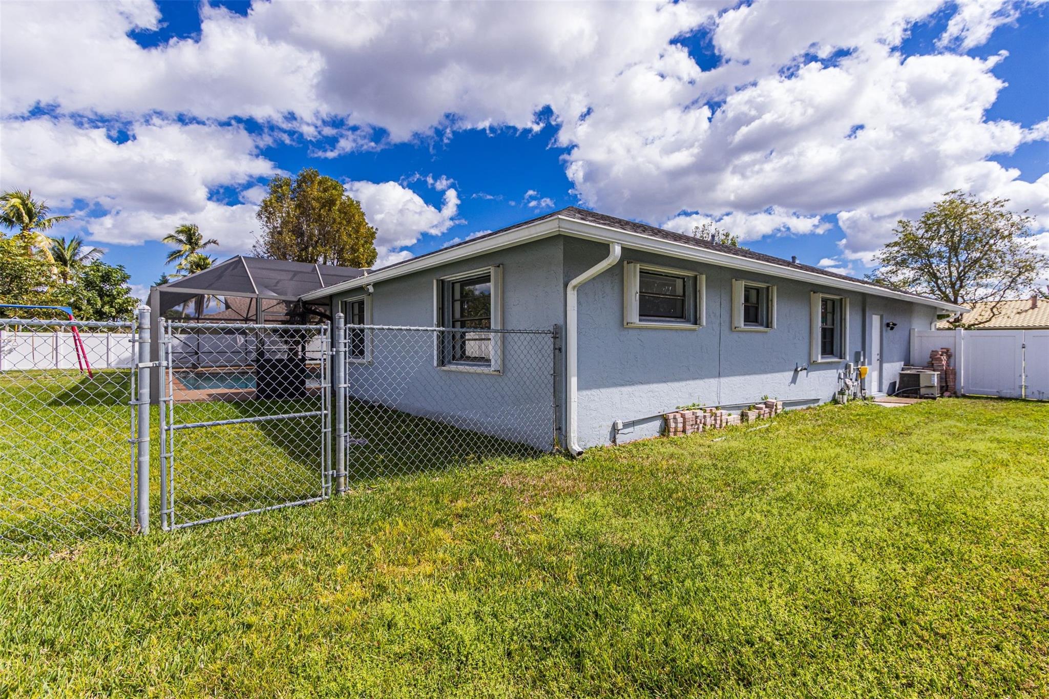 Rear of house showing extra fence at rear yard