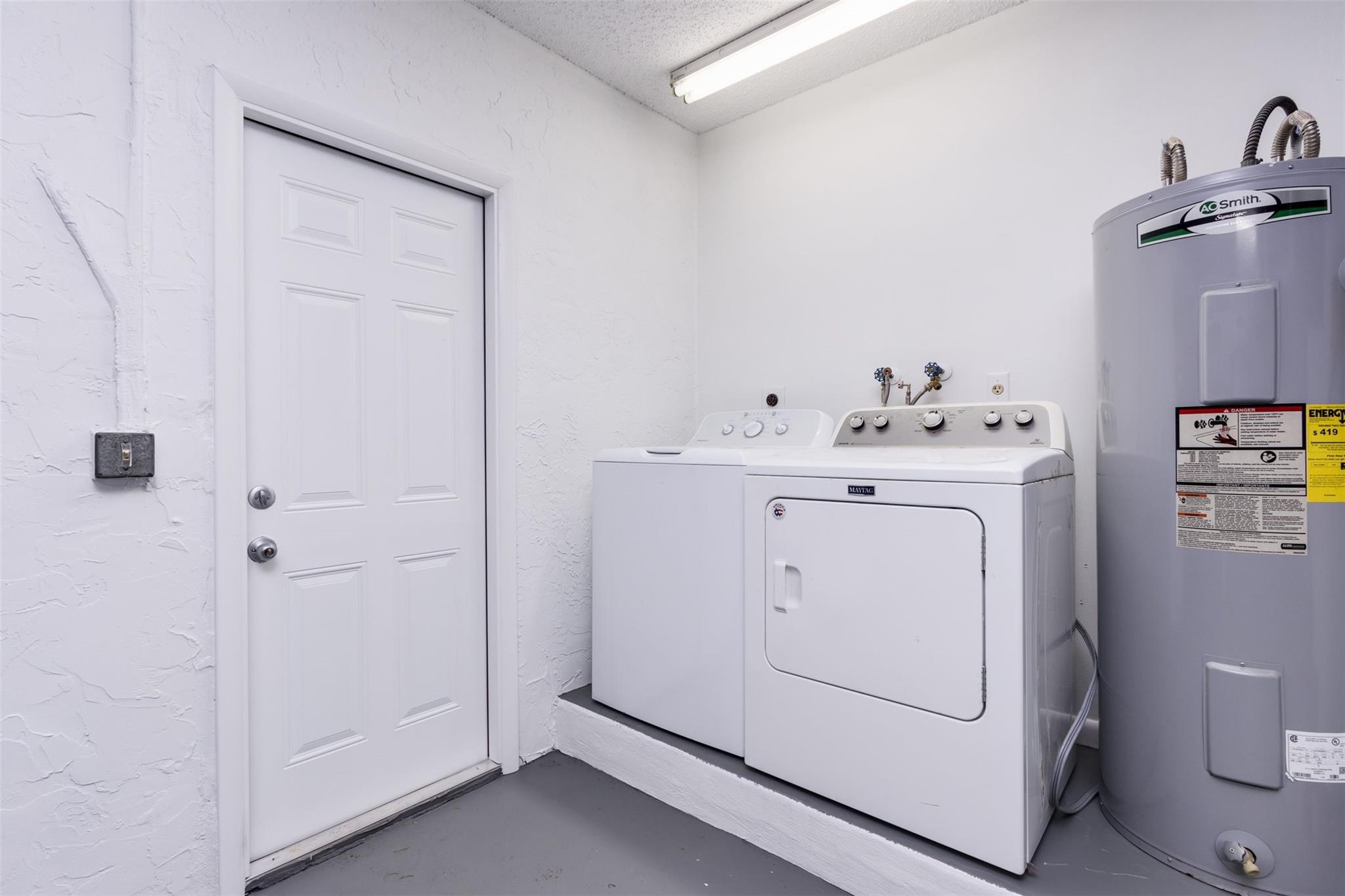 washer and dryer in garage  Note huge water heater
