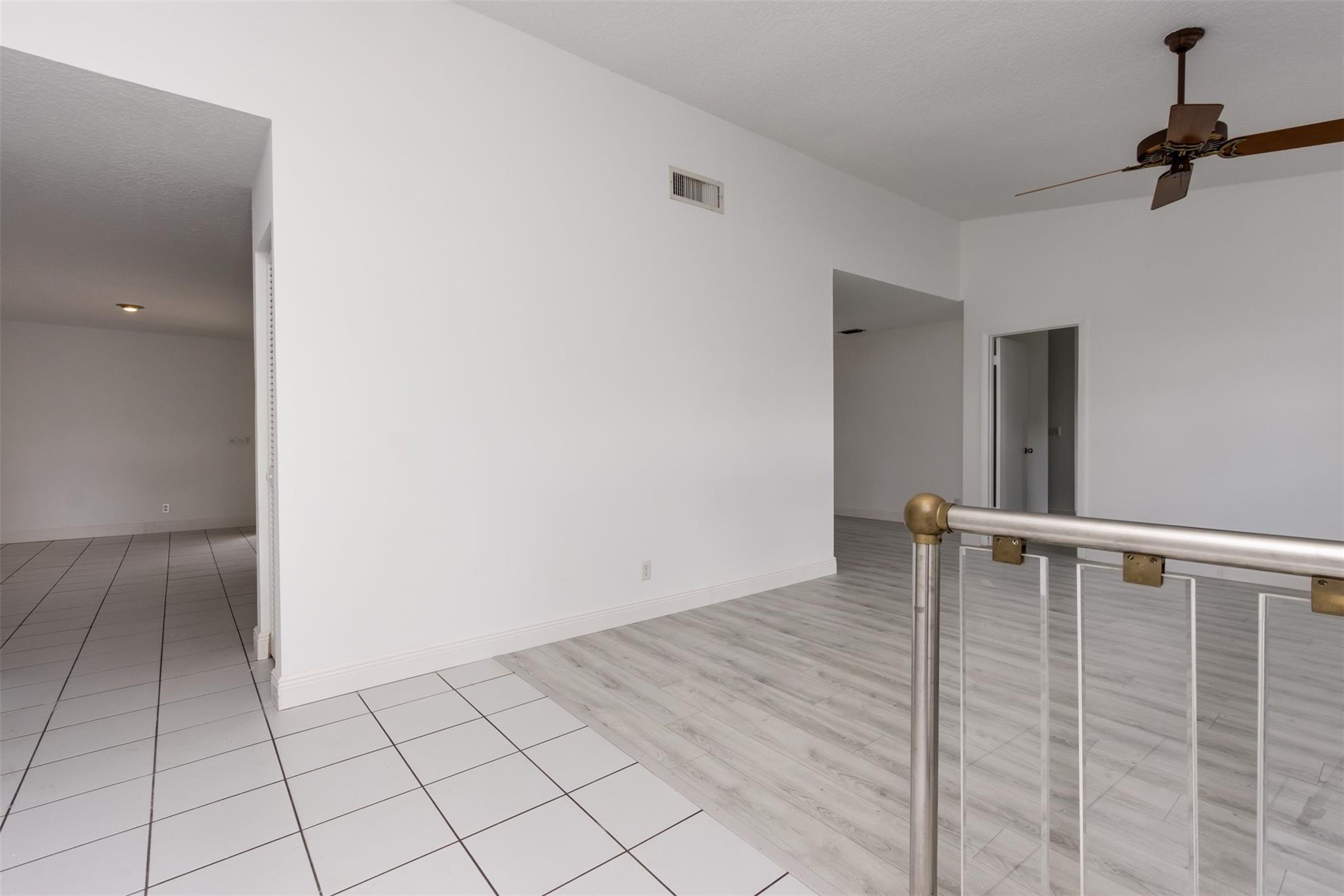 Foyer looking toward living room, dining area, and family room