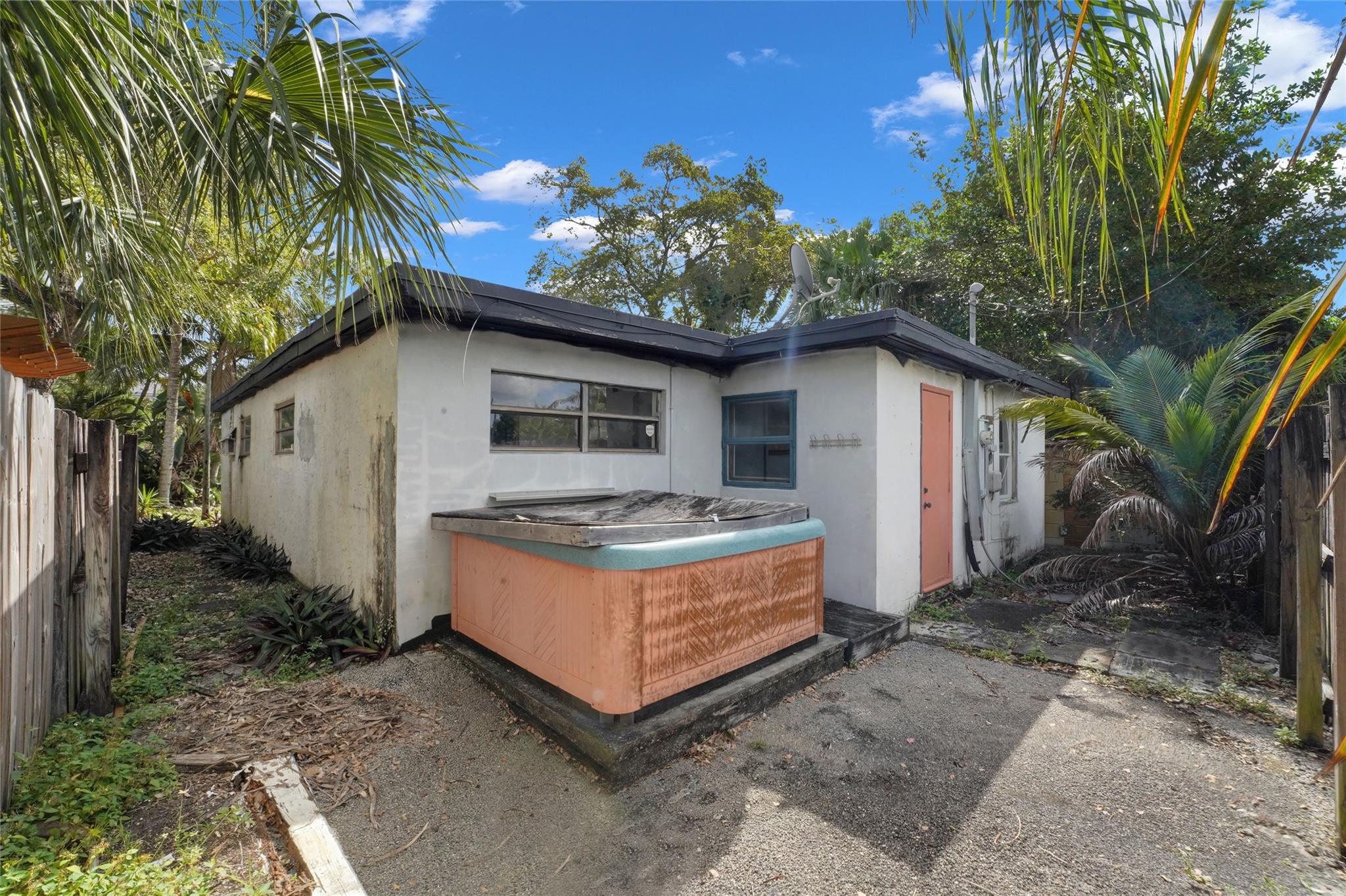 Rear of 2715 NE 6th Ln structure w/ whirlpool