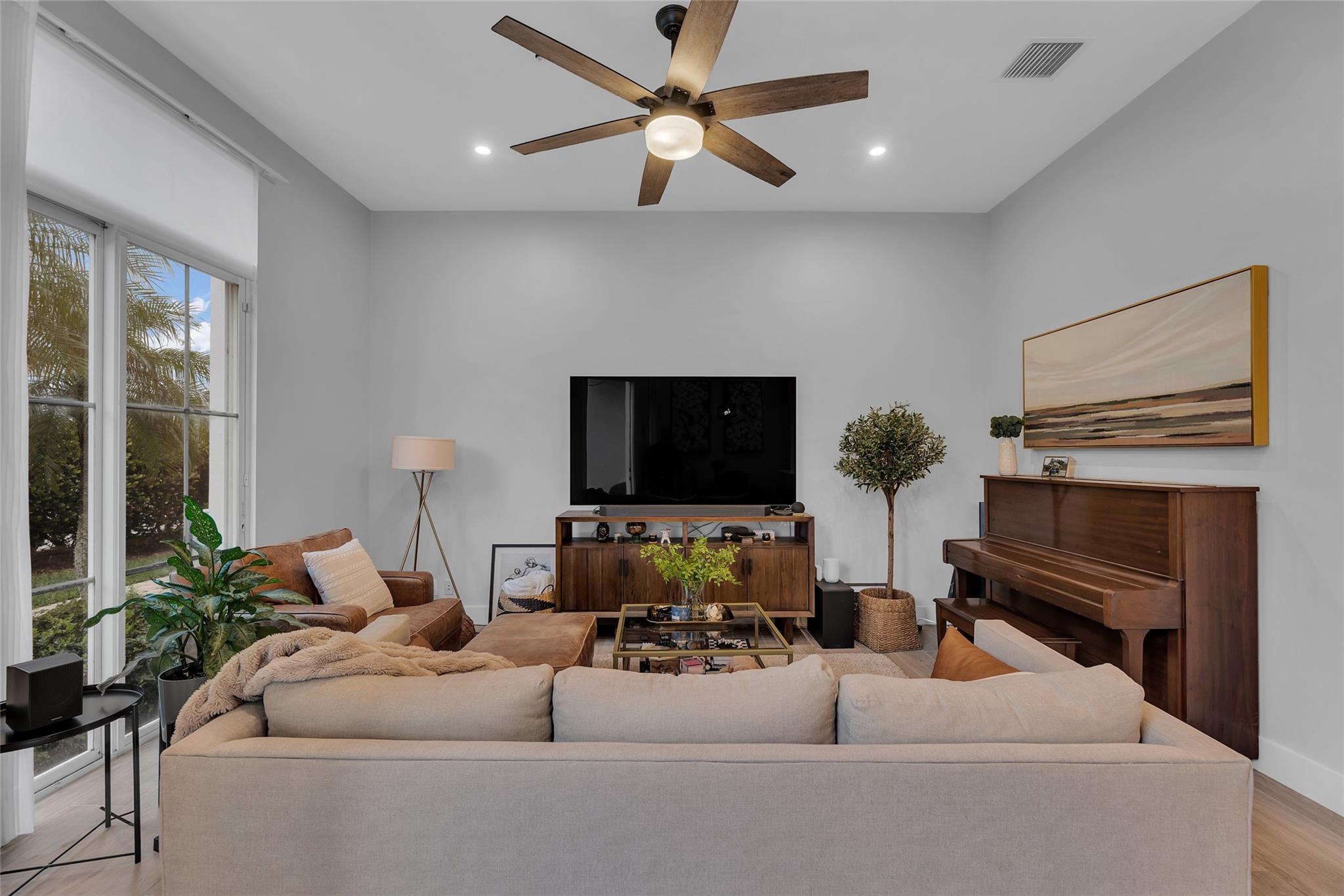 Living room offers an abundance of natural light and great recessed lighting