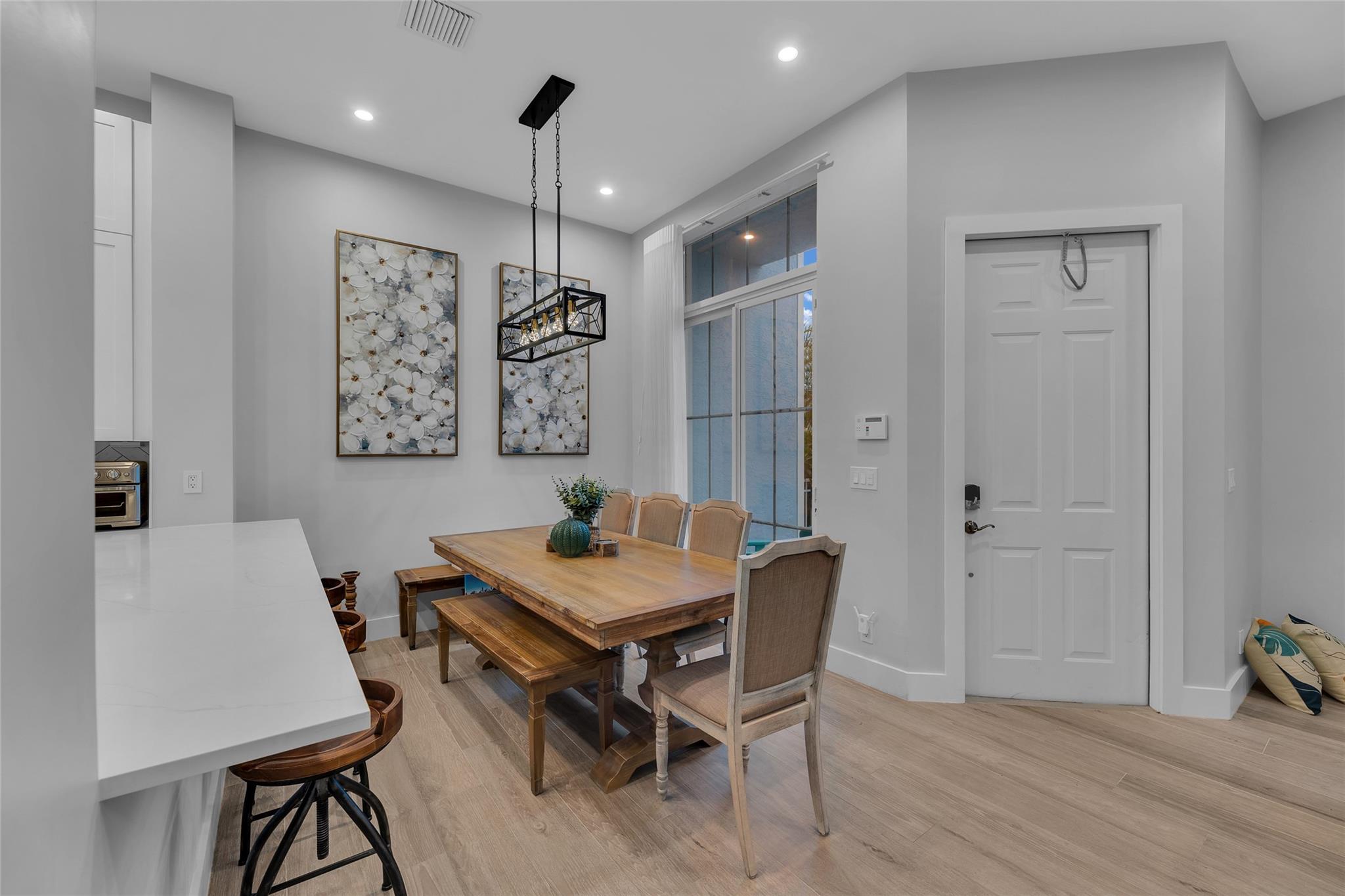 Dining room with custom lighting and great natural light