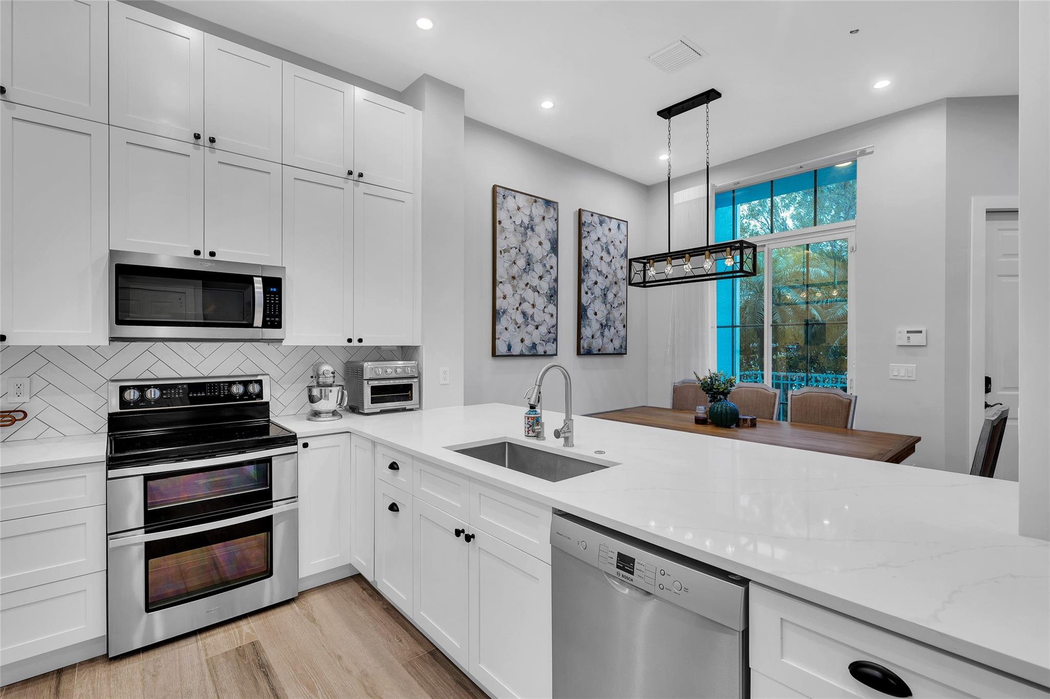 Open and spacious kitchen with recessed lighting and great natural light