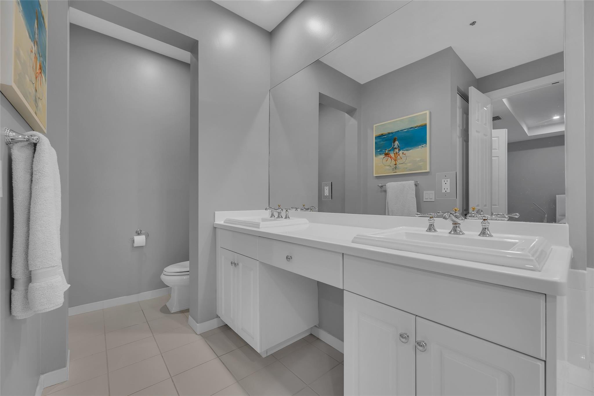 Master bathroom with double vanity and separate water closet