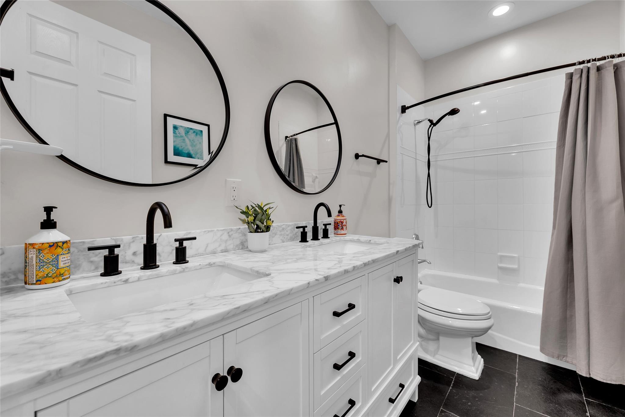 Hall bathroom for bedrooms 2 & 3 with Quartz counters and tub/shower combo