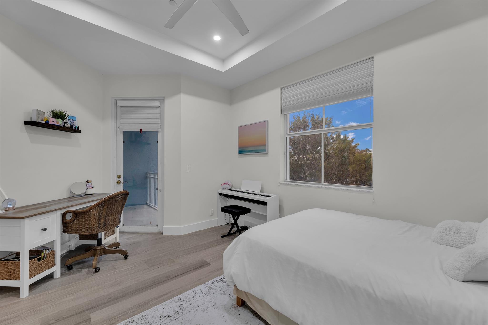Third Bedroom with raised coffered ceilings and recessed lighting