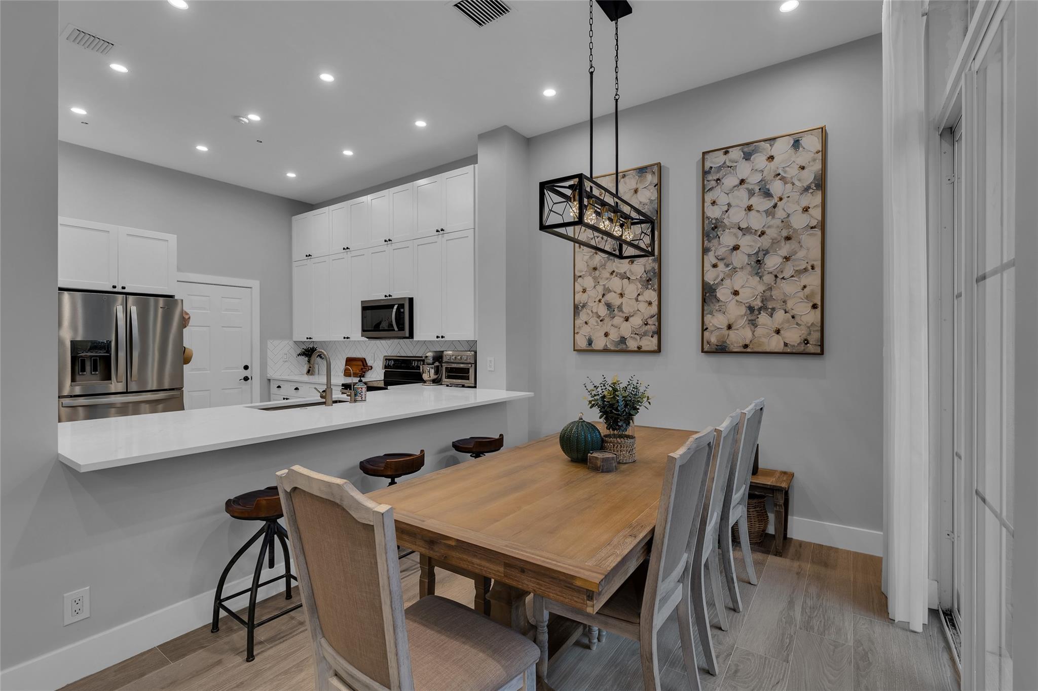 Dining room offers designer lighting and great natural light