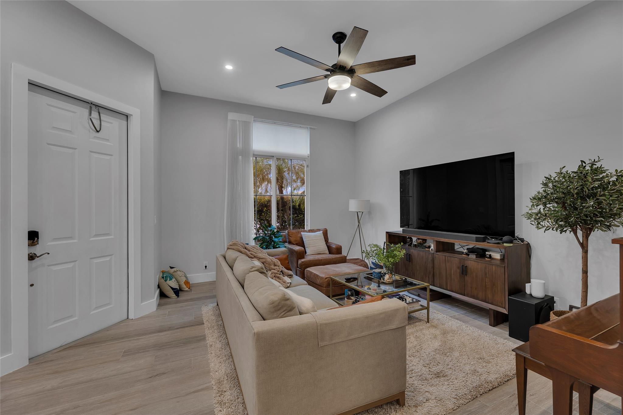 Living room with recessed lighting  and sliders to patio