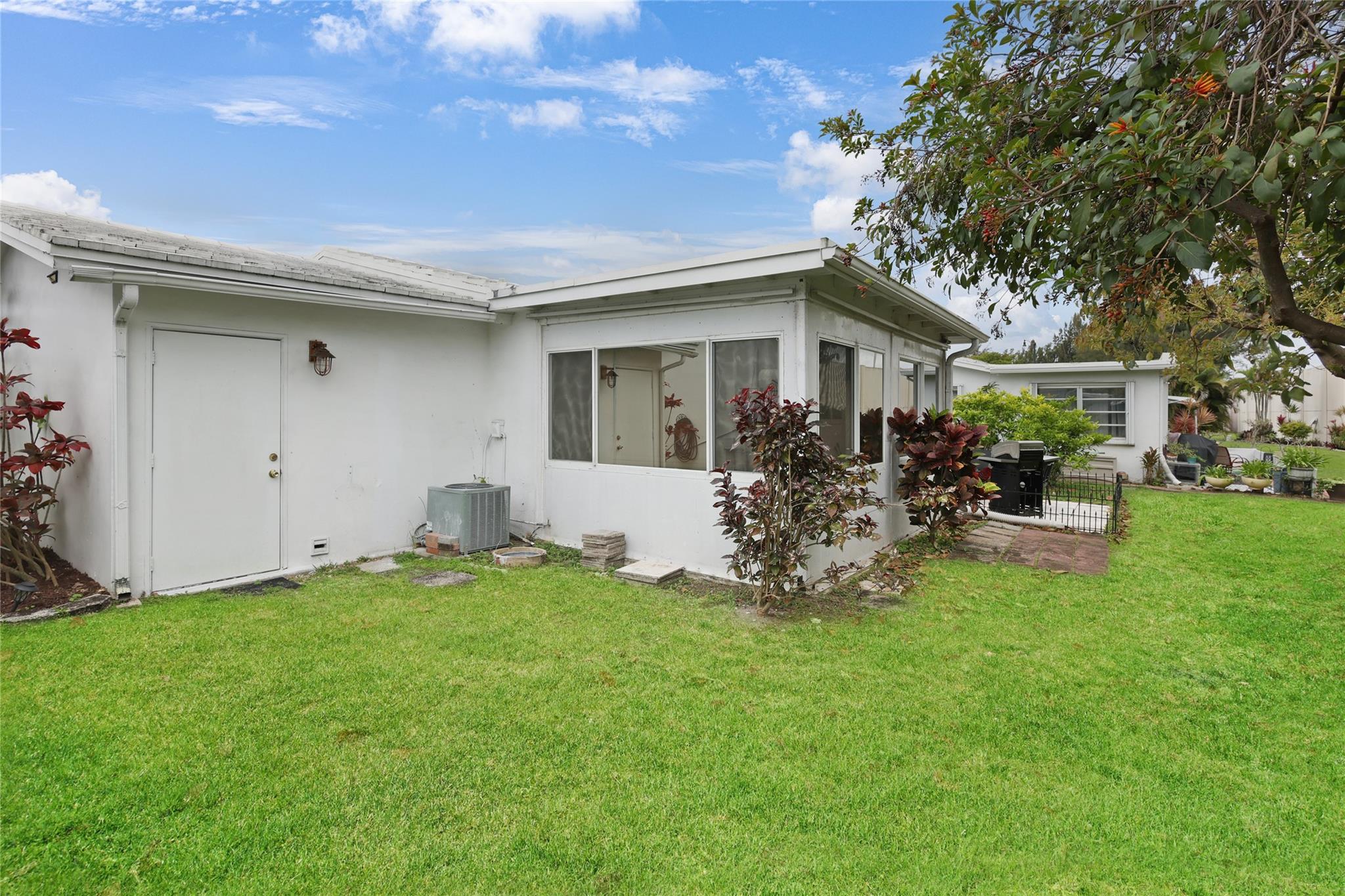 Side of home and back door to garage.