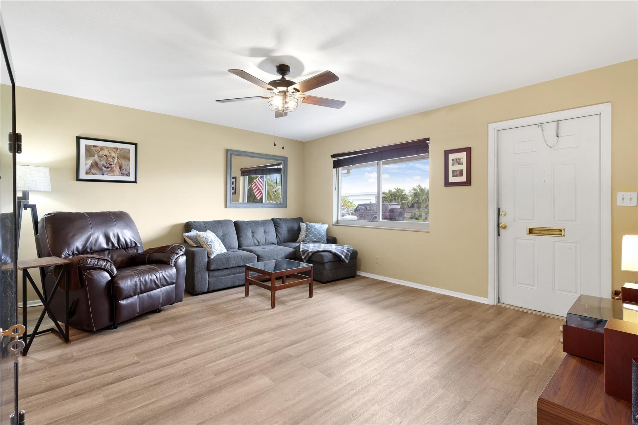 Spacious Living room area.  Impact Windows for security and great natural light.