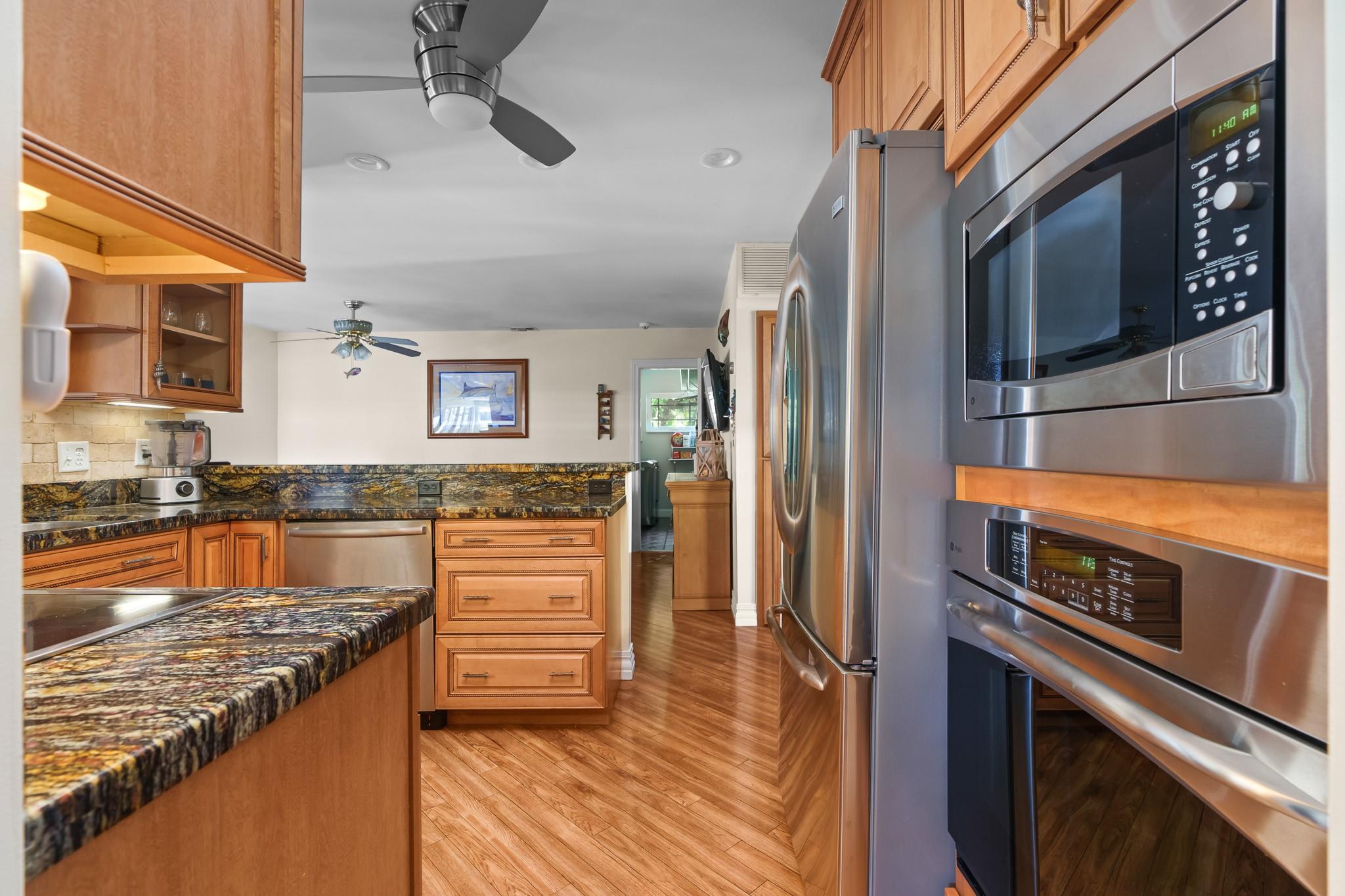 Wonderful, open kitchen area has access to both formal dining and casual as well... Seating for dozens, no problem!