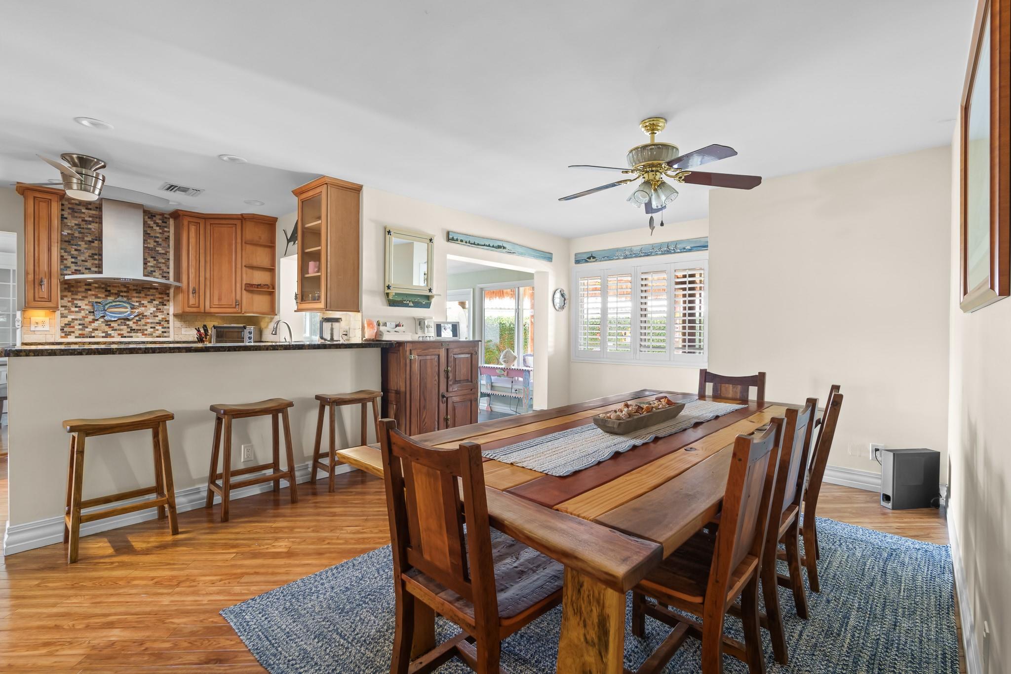 Snack bar and casual dining leads out to Florida room, tiki, tropically landscaped back yard and waterfront escape
