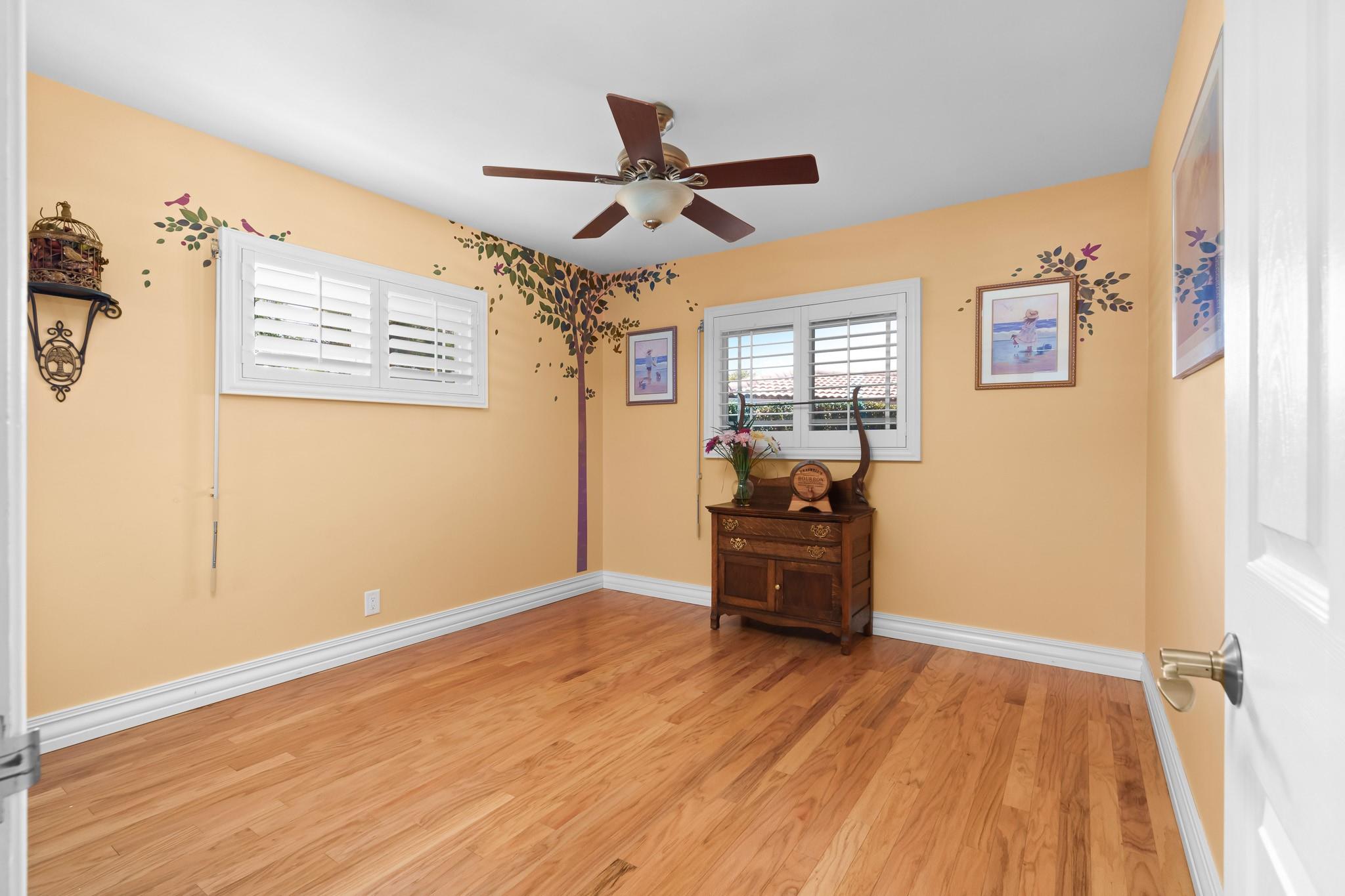 Bedroom #2 on the east side of the home, split away from Primary and separated from bedroom #3 by a second updated bathroom