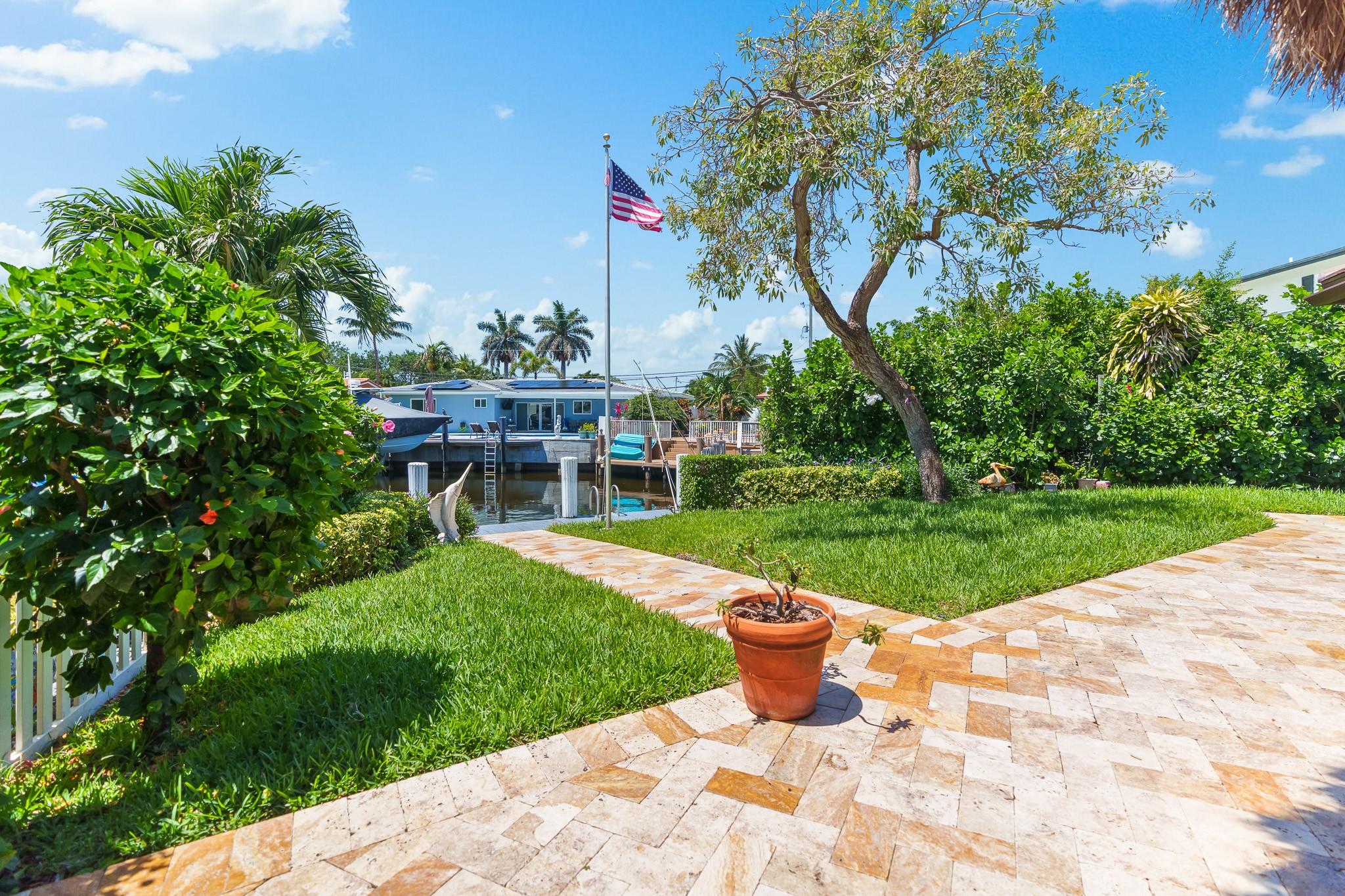 Colorful travertine walkway to dock and back patio area.