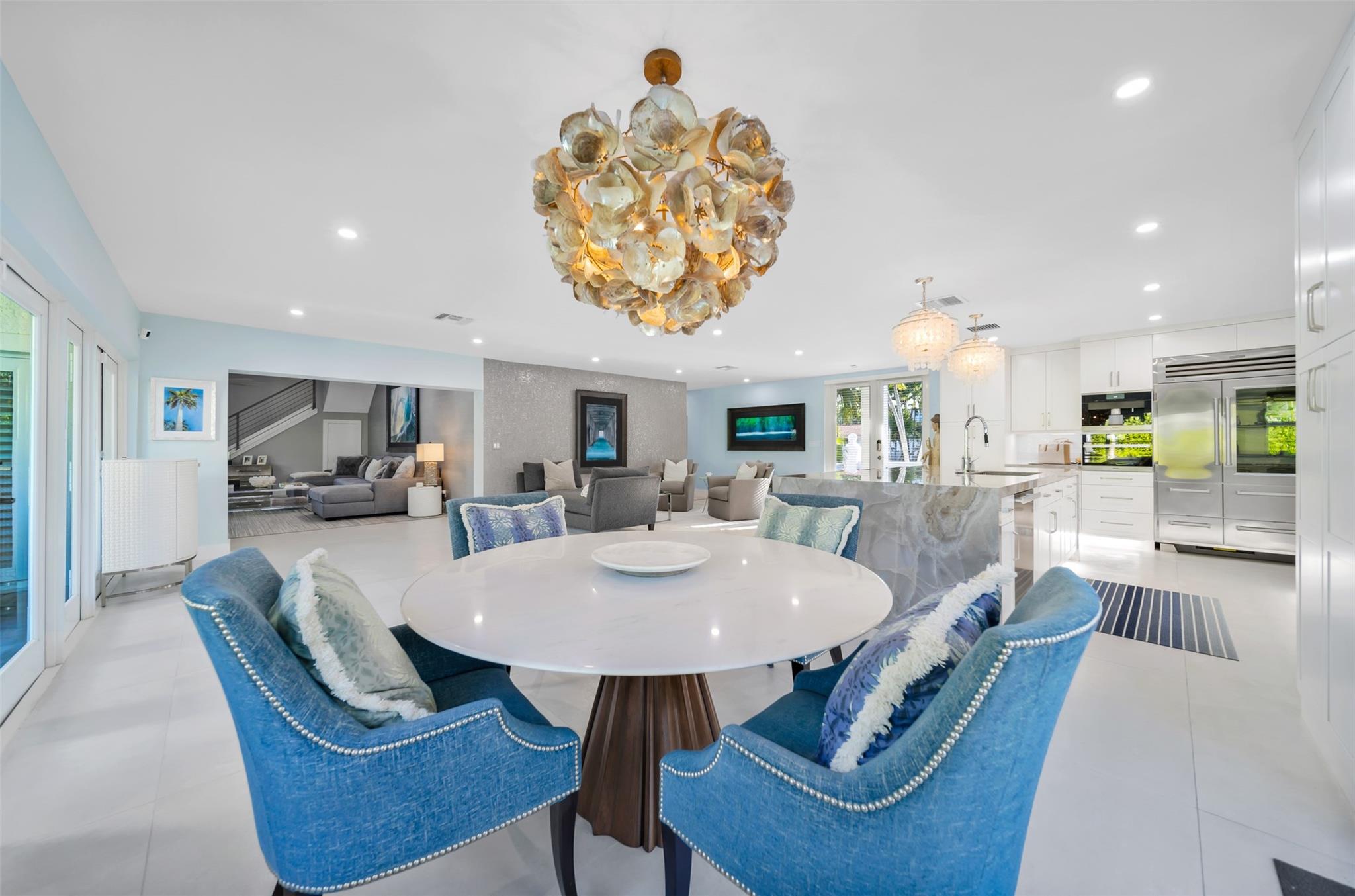 Dinning room table from view from windows towards the family room plus formal living room and kitchen to the right.