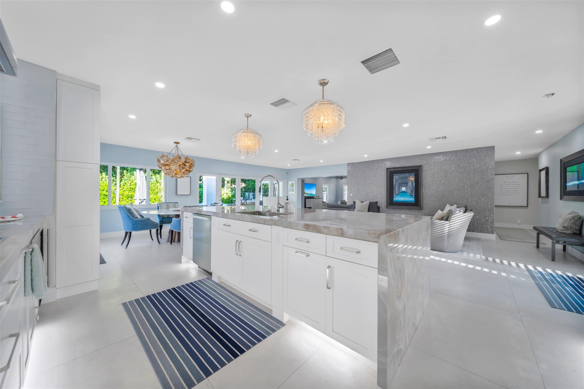 This kitchen is a show stopper, extra deep quartz waterfall counter and 131