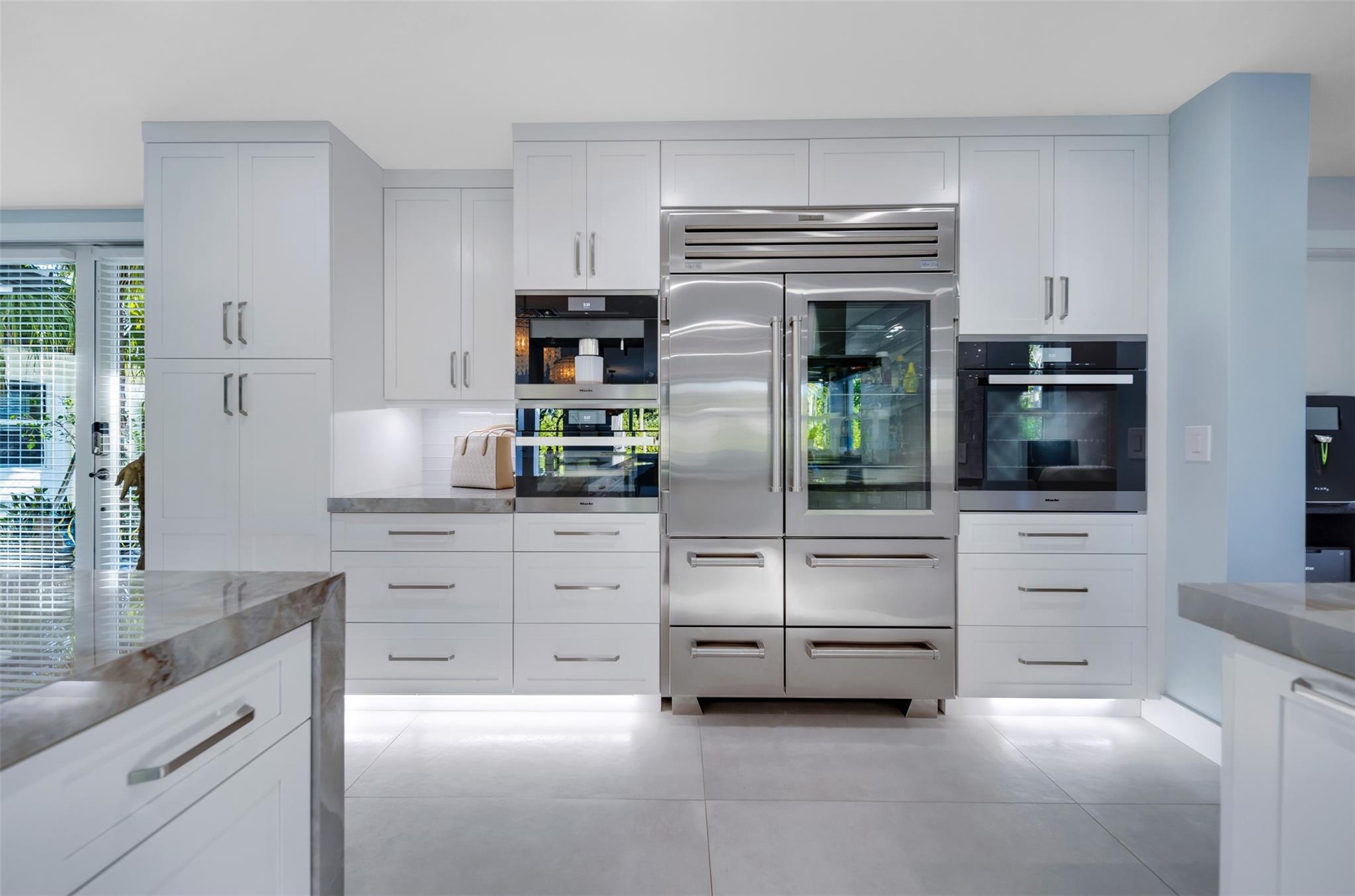 MILE steam oven & oven, SUB-Zero Fridge, Plumbed coffee maker, under cabinet lighting.