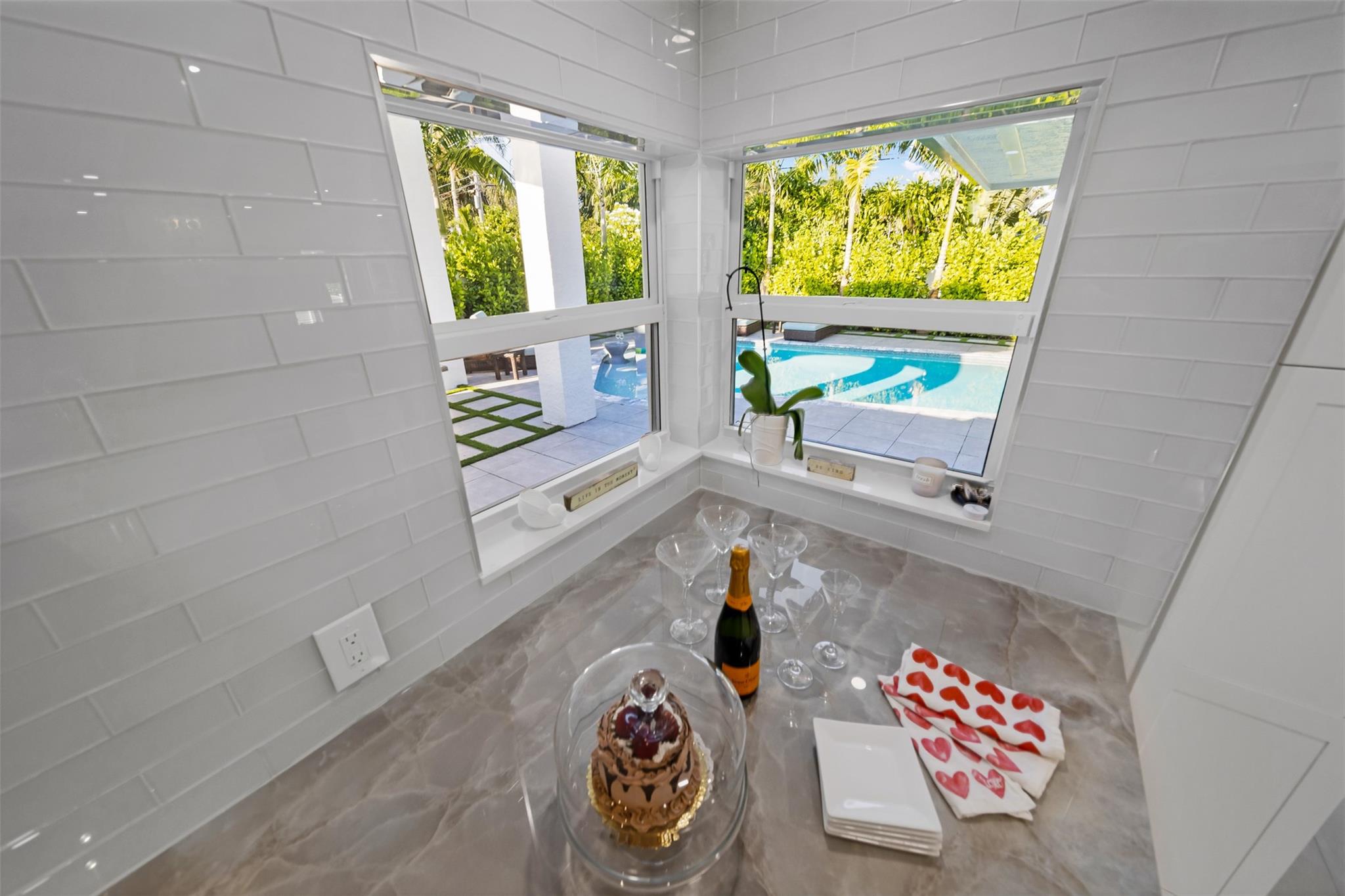 View from kitchen window to pool area.