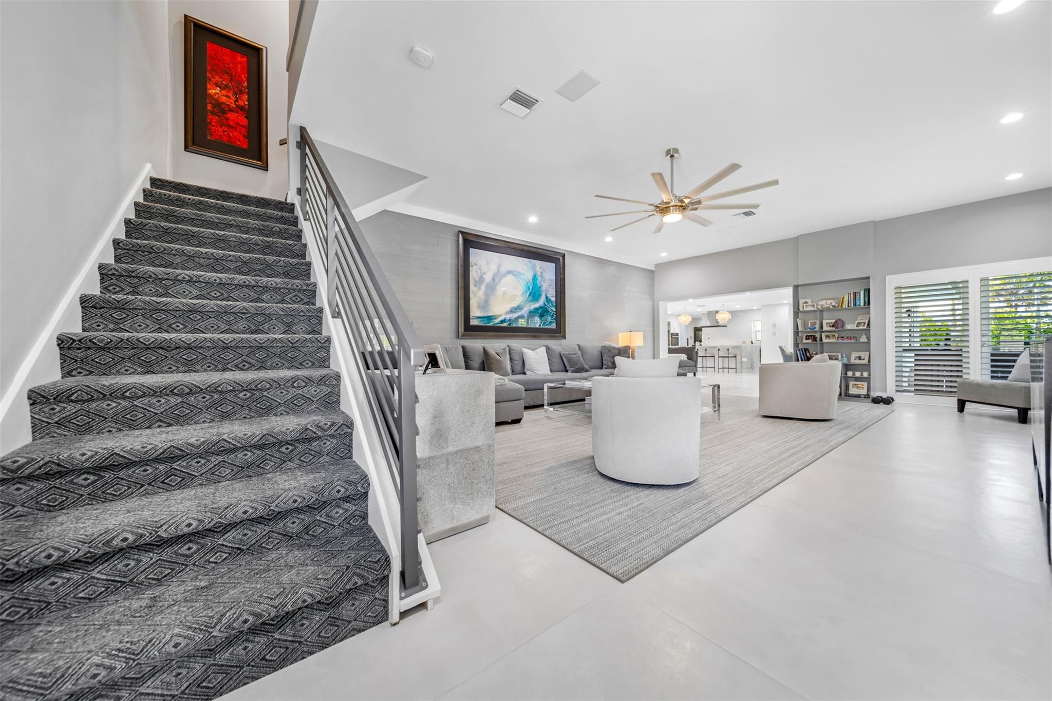 Stair case to second floor primary suite & primary bathroom, second floor balcony.
