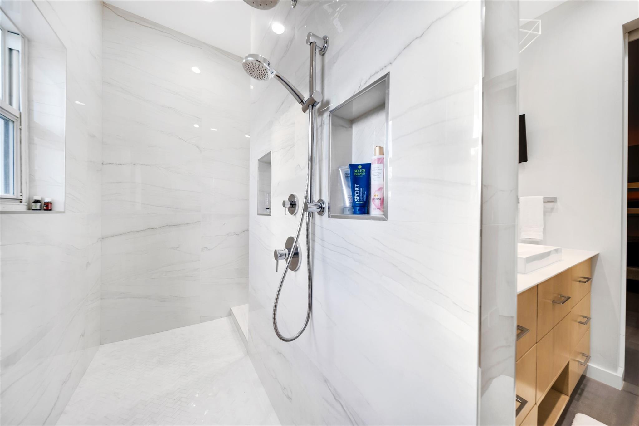 Primary suite bathroom, has a luxury spa feel.