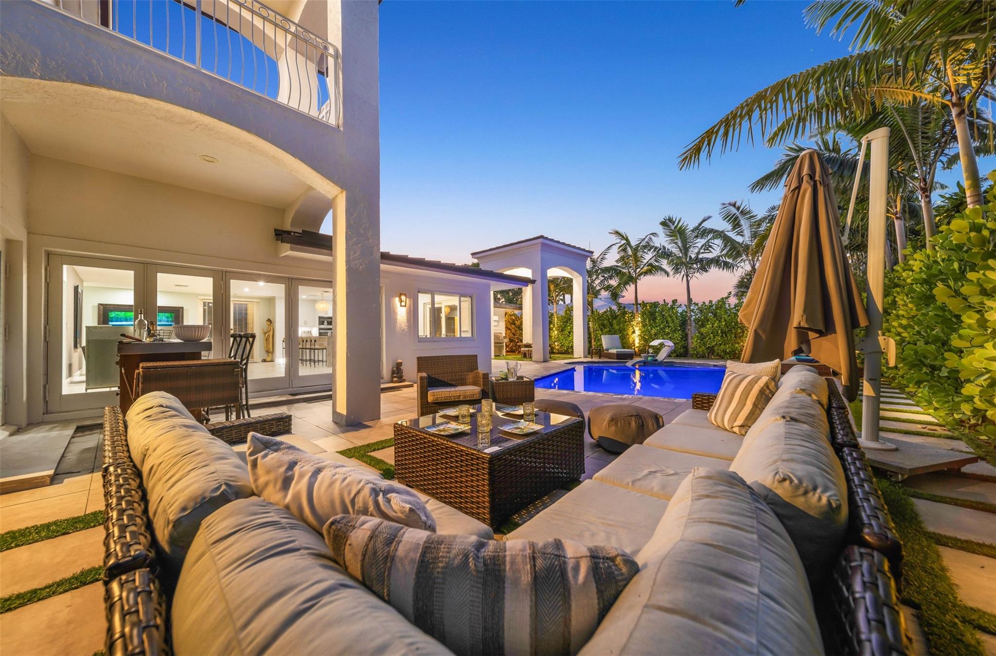 You just don't want to go back inside with this cozy pool paradise!