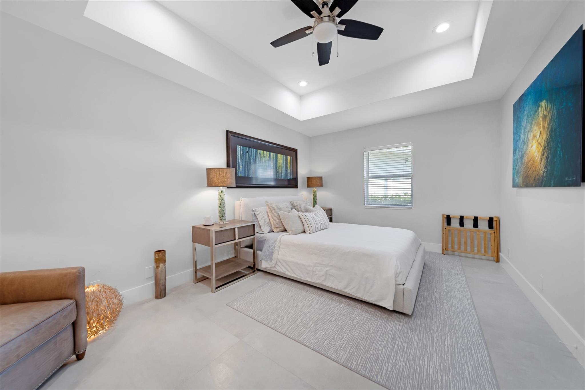 2nd bedroom with recessed ceiling, ceiling fan.