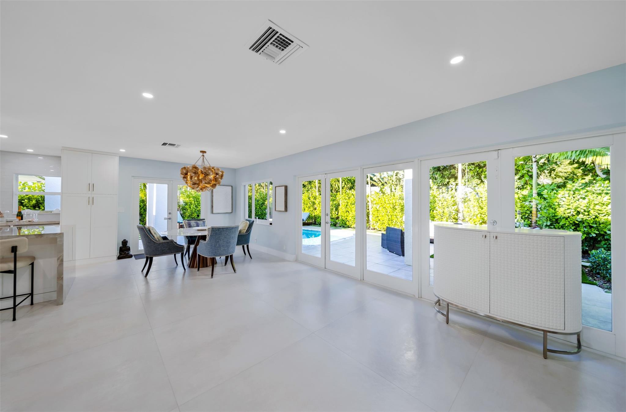 So much room for moving around between kitchen, dining area and to the outdoor living areas.