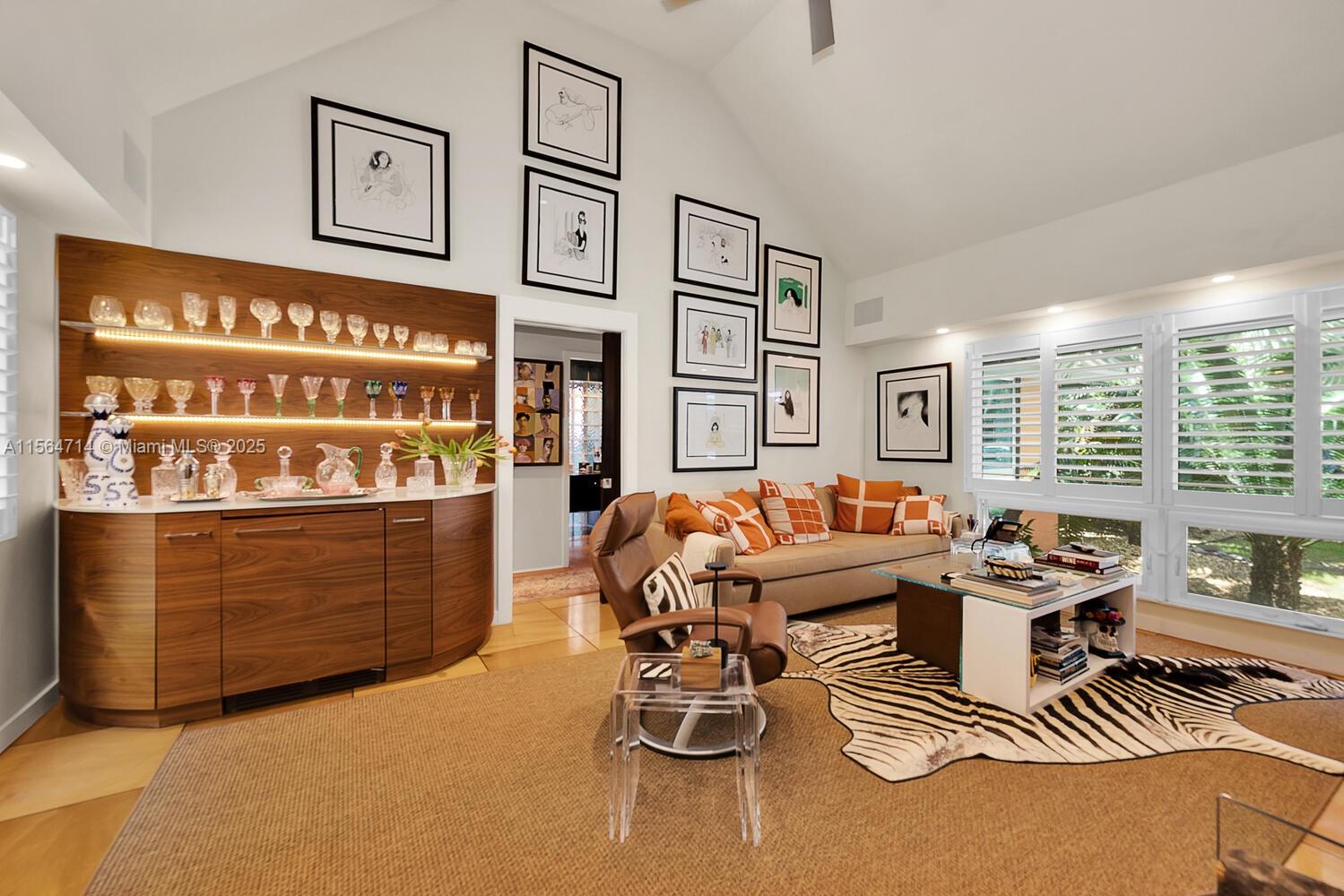 Captivating, coastal contemporary home in coveted South Coconut Grove - just a short walk to the village center’s boutiques, cafes, top-tier schools and bayfront parks & marinas.  Expansive, 13,800 SF of gated grounds w/lush tropical landscaping. Light-filled living spaces offer vaulted ceilings & are ideal for displaying art collections. Stunning kitchen w/ custom cabinetry & top-of-the-line (Sub-Zero) appliances. Split bedroom layout has an ultra-private primary suite w/ incredible spa-like bath + a separate bedroom wing with 3BR/2BA. Bonus 2nd level office/den. 2 car garage + attached guest suite. Enjoy resort-style outdoor living in the large gazebo w/ summer kitchen overlooking the glistening pool & sundeck. Located close to Coral Gables and minutes to downtown, MIA & the Beaches.