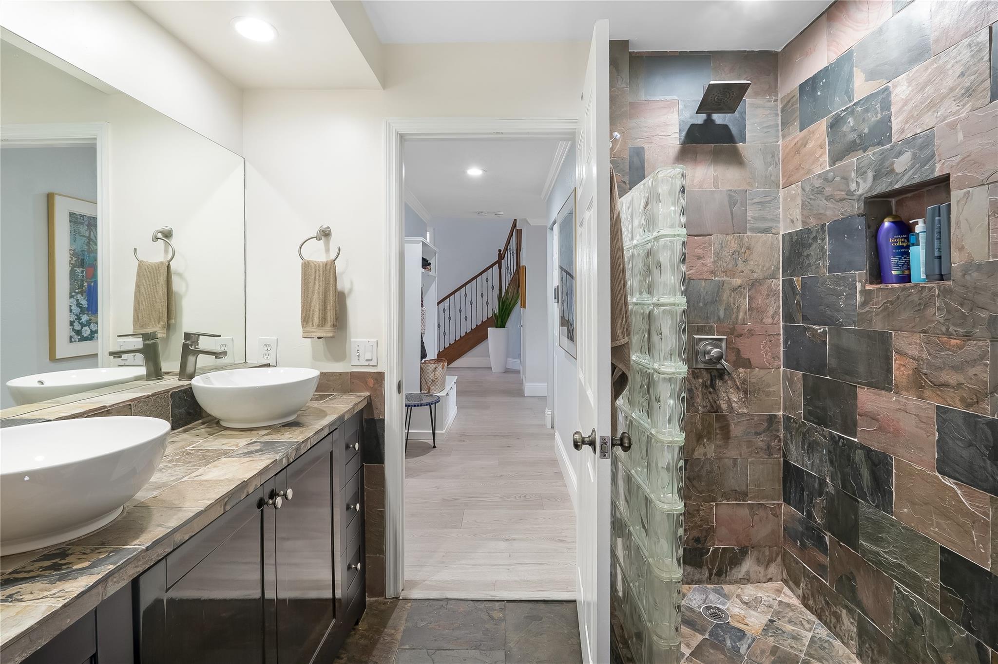 Door to pool and side yard in 3rd full bathroom
