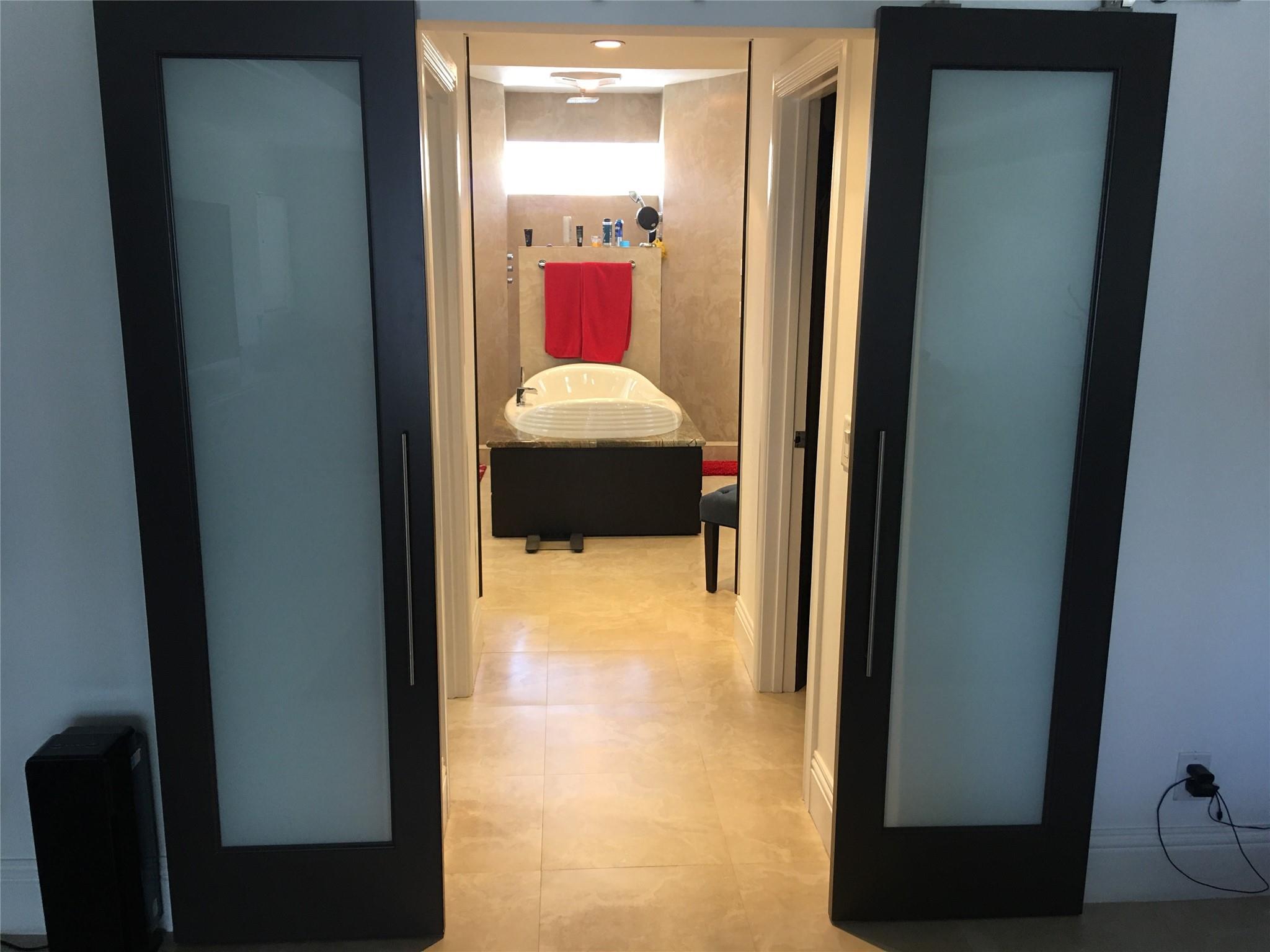 ENTRANCE TO HIS & HER'S CLOSETS & MASTER BATHROOM