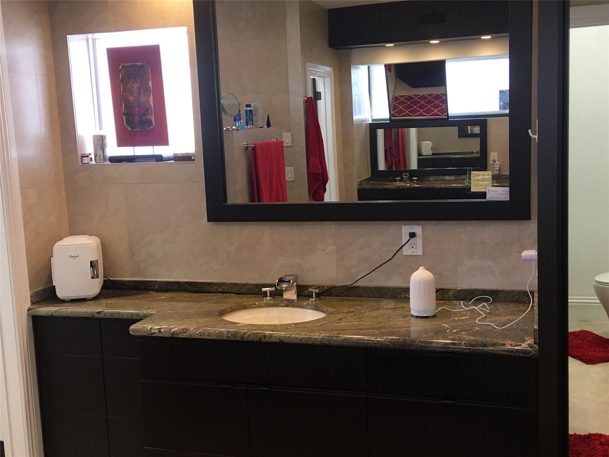 MASTER BEDROOM HER PERSONAL AREA WITH GRANITE TOP CABINET & SINK