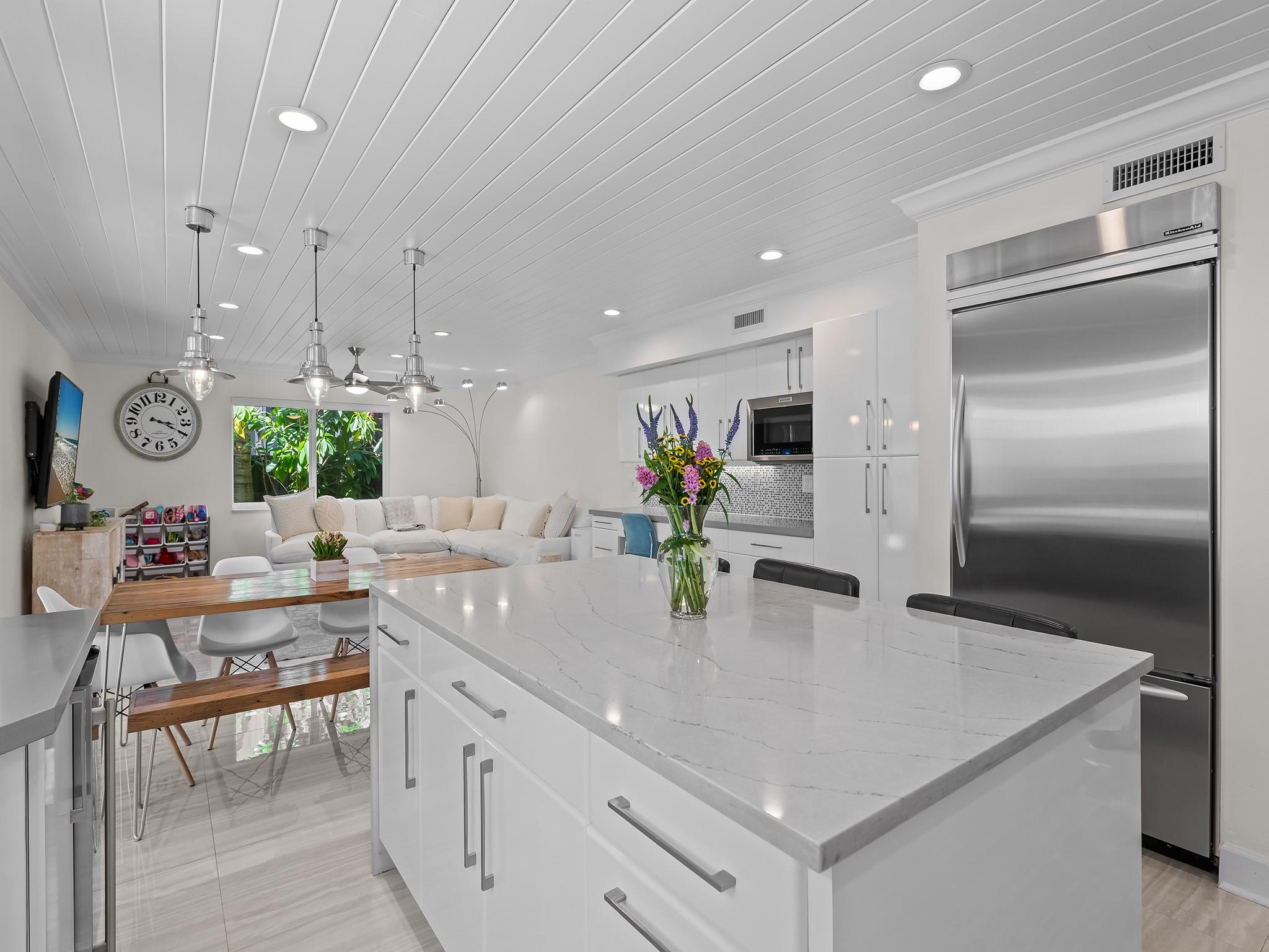 Chef's Kitchen With Large Center Island, Custom Cabinets,  Pantry, Double Ovens, Oversize Refrigertor & Free-Standing Ice Maker.