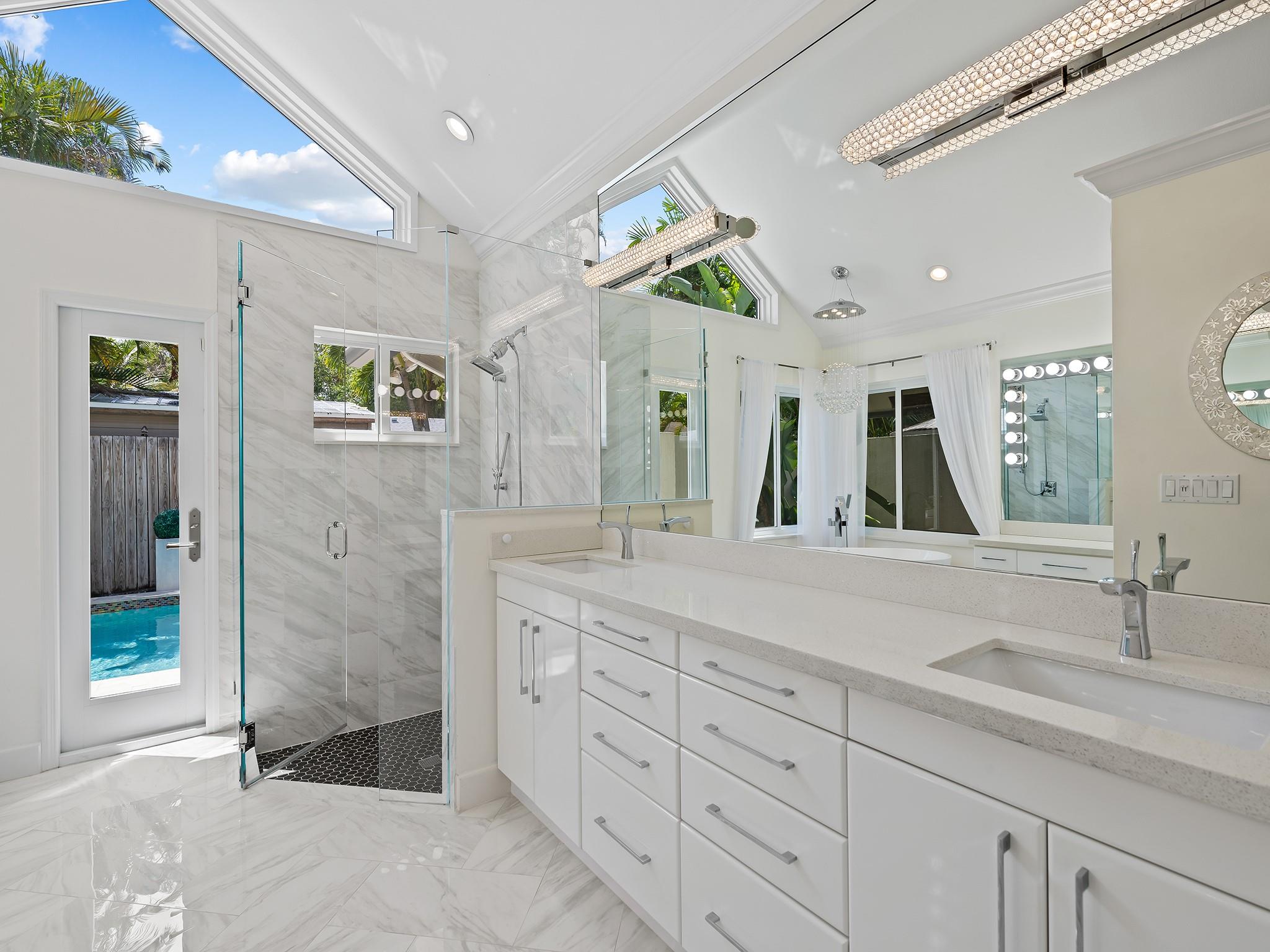 Primary Bathroom with Large Soaking Tub For Two, Custom Vanity With Lighting & Crystal Chandelier