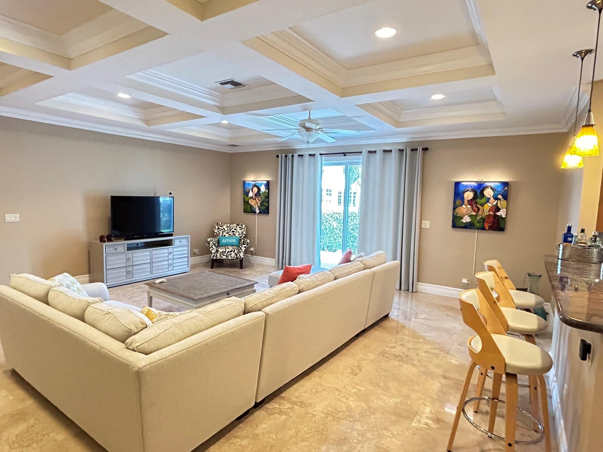Tray Ceiling design with high hat lighting in the great room