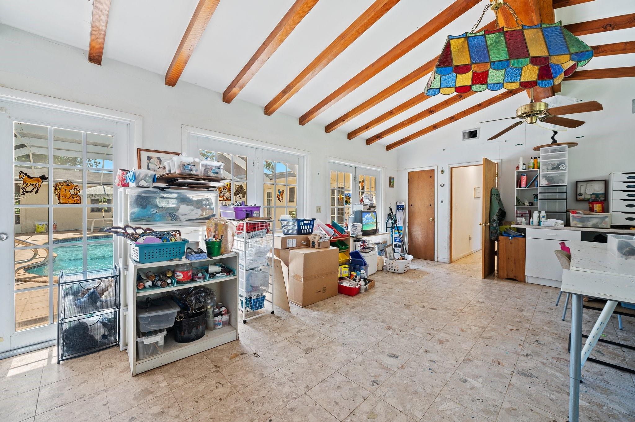 VAULTED CEILING. 3 FRENCH DOORS TO PATIO/POOL. DOOR TO 57X35 GARDEN AREA