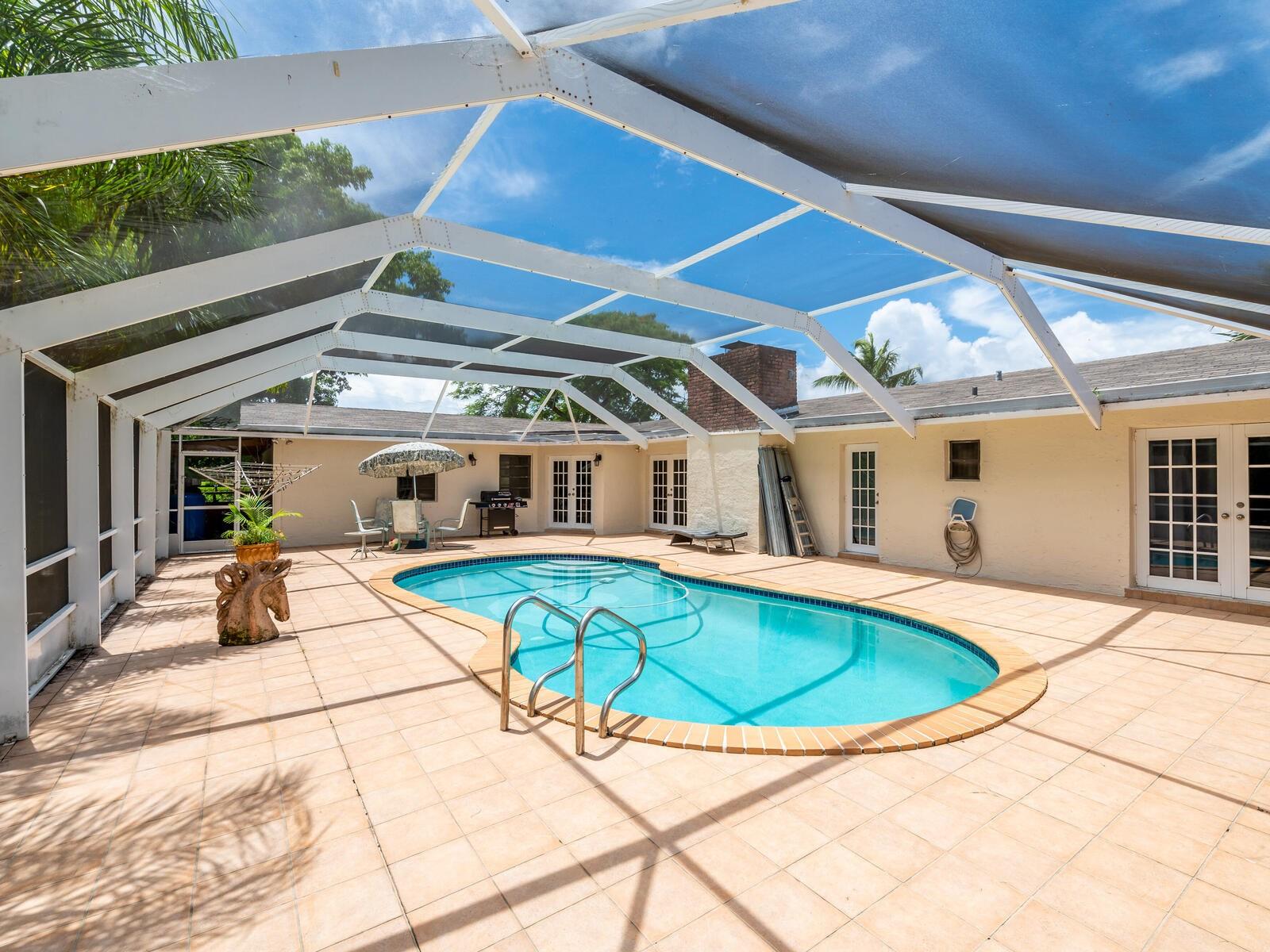 DOMED SCREENED PATIO AND POOL